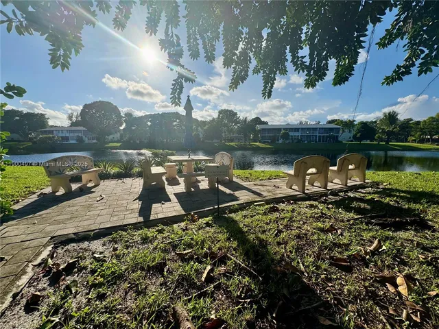 a view of a pathway with a yard