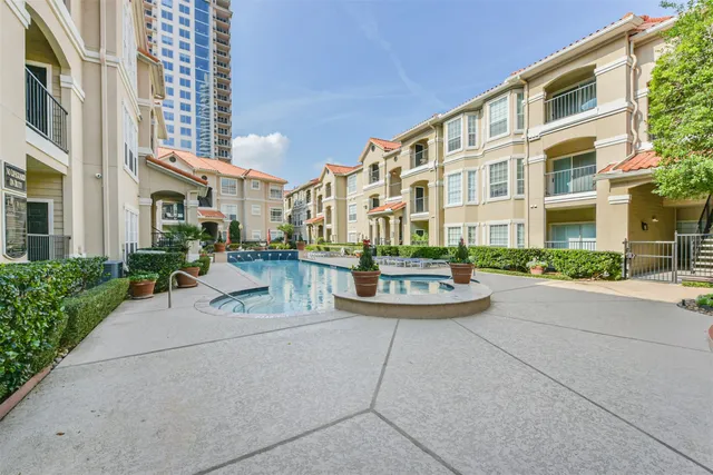 a view of a livingroom with wooden floor and windows