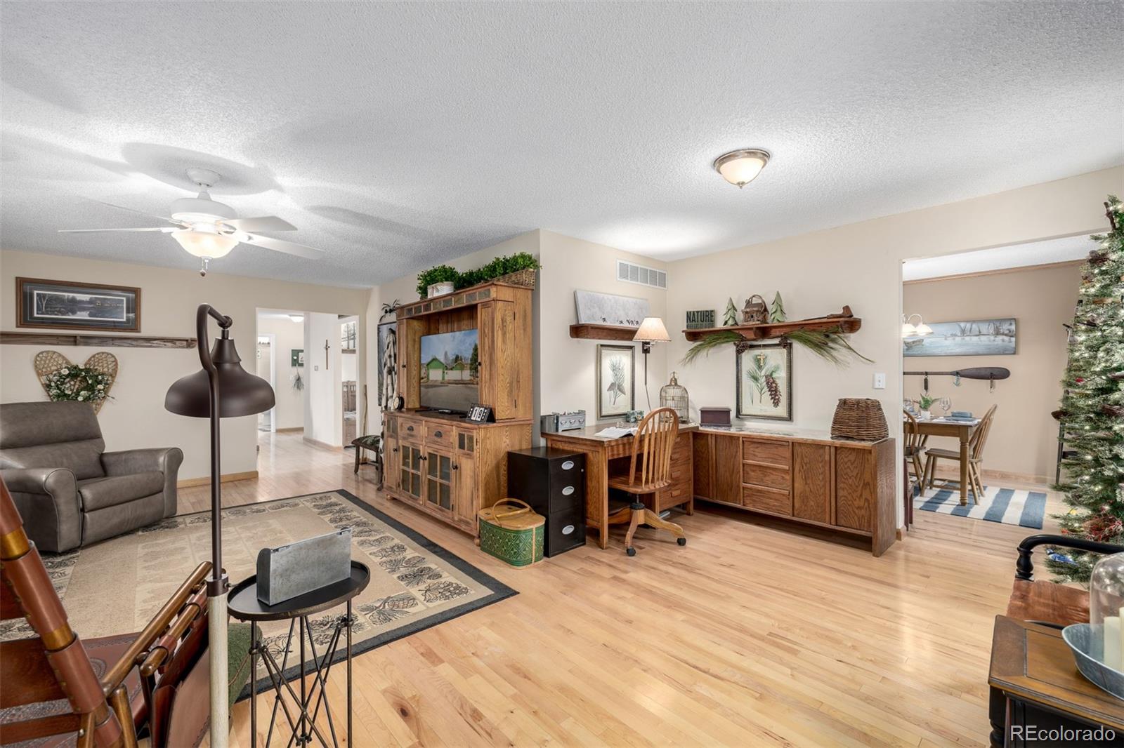 22 Scott Drive North Broomfield, CO 80020 - Photo 12 of 49 a living room with furniture and wooden floor