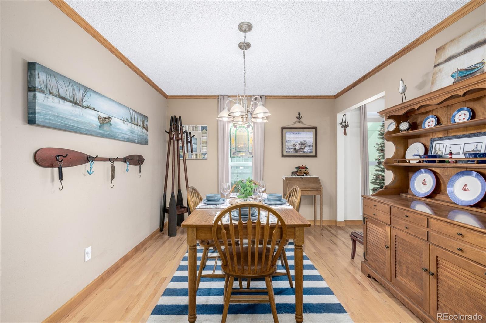 22 Scott Drive North Broomfield, CO 80020 - Photo 14 of 49 a view of a hallway with furniture and chandelier