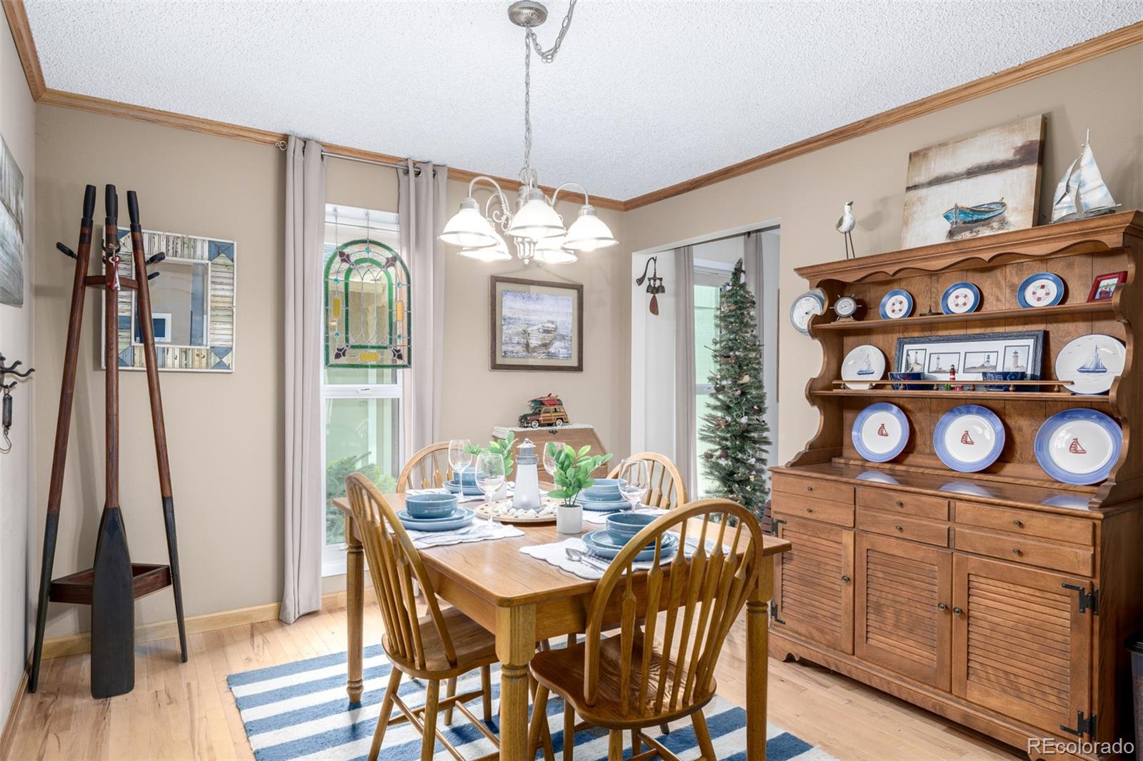 22 Scott Drive North Broomfield, CO 80020 - Photo 15 of 49 a view of a dining room with furniture window and wooden floor