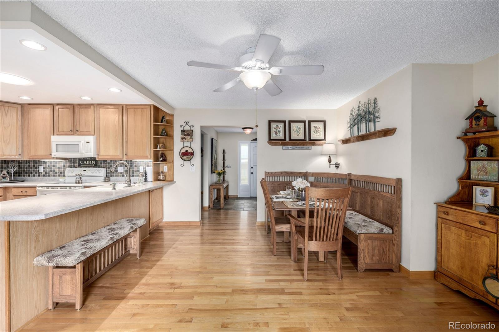 22 Scott Drive North Broomfield, CO 80020 - Photo 19 of 49 a living room with stainless steel appliances kitchen island granite countertop furniture and a kitchen view