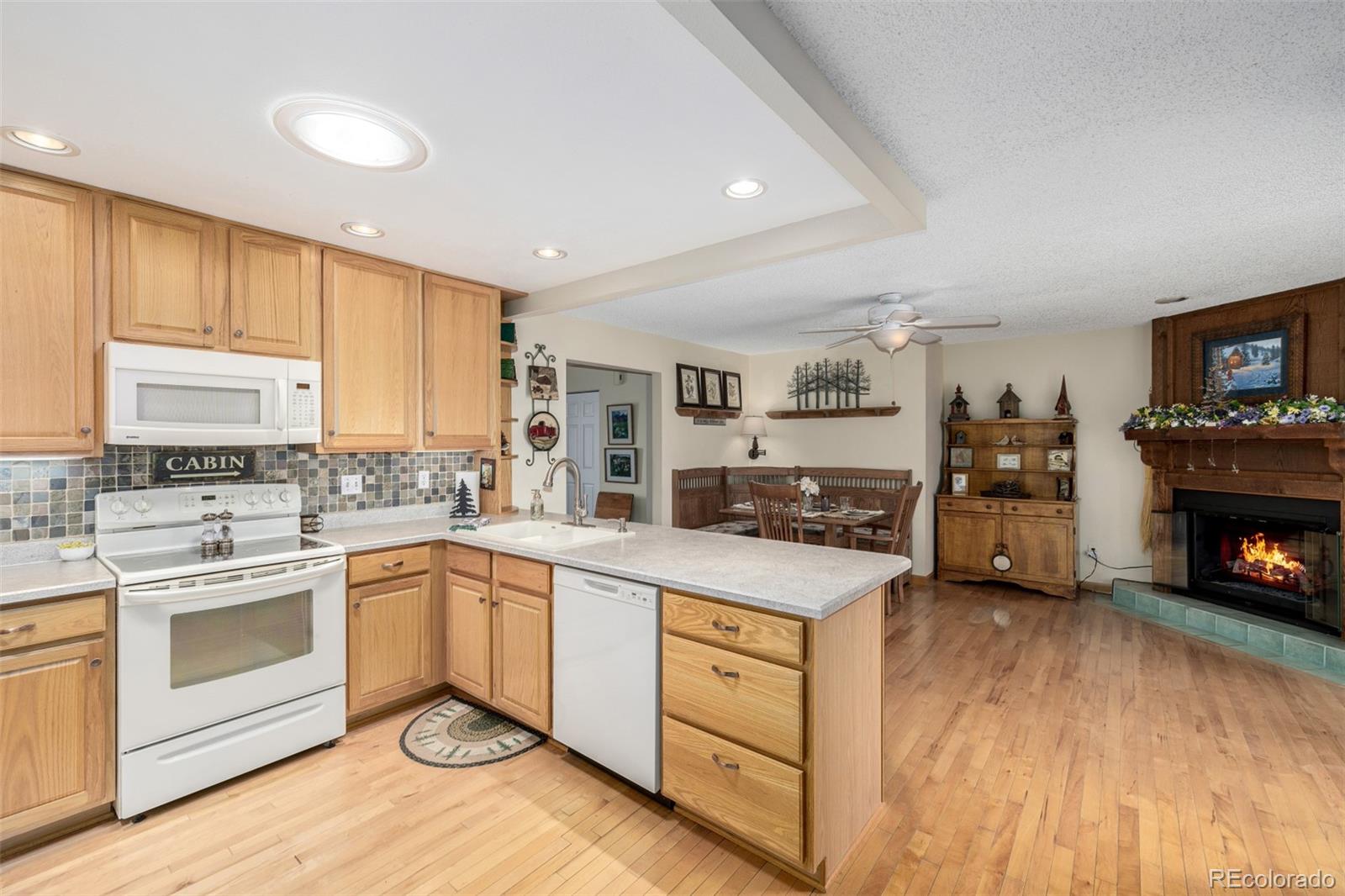 22 Scott Drive North Broomfield, CO 80020 - Photo 24 of 49 a kitchen with a stove sink and cabinets