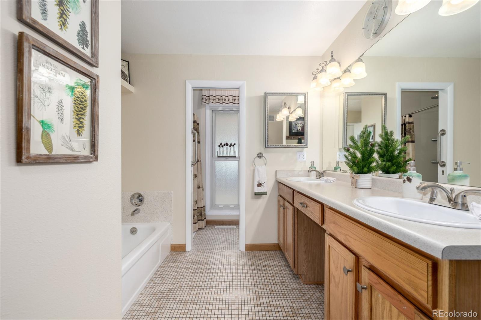 22 Scott Drive North Broomfield, CO 80020 - Photo 29 of 49 a spacious bathroom with a granite countertop sink mirror and a bathtub