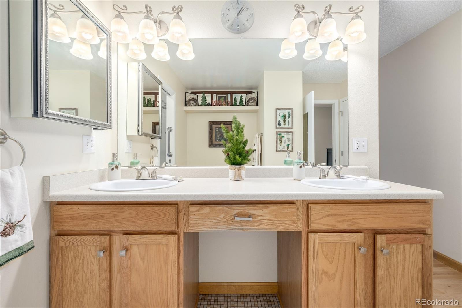 22 Scott Drive North Broomfield, CO 80020 - Photo 30 of 49 a bathroom with a sink vanity and a mirror
