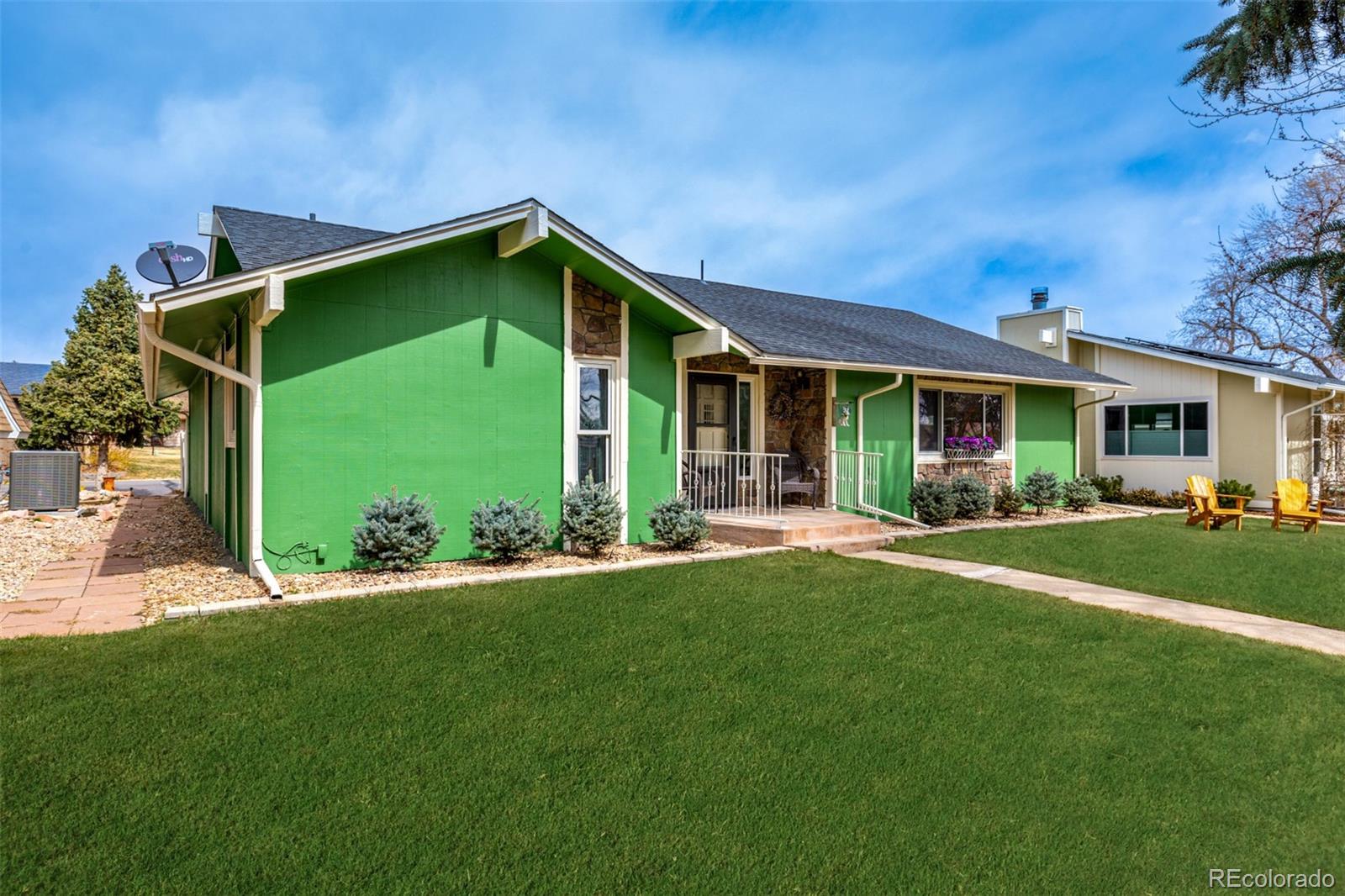 22 Scott Drive North Broomfield, CO 80020 - Photo 3 of 49 a front view of a house with a yard and porch