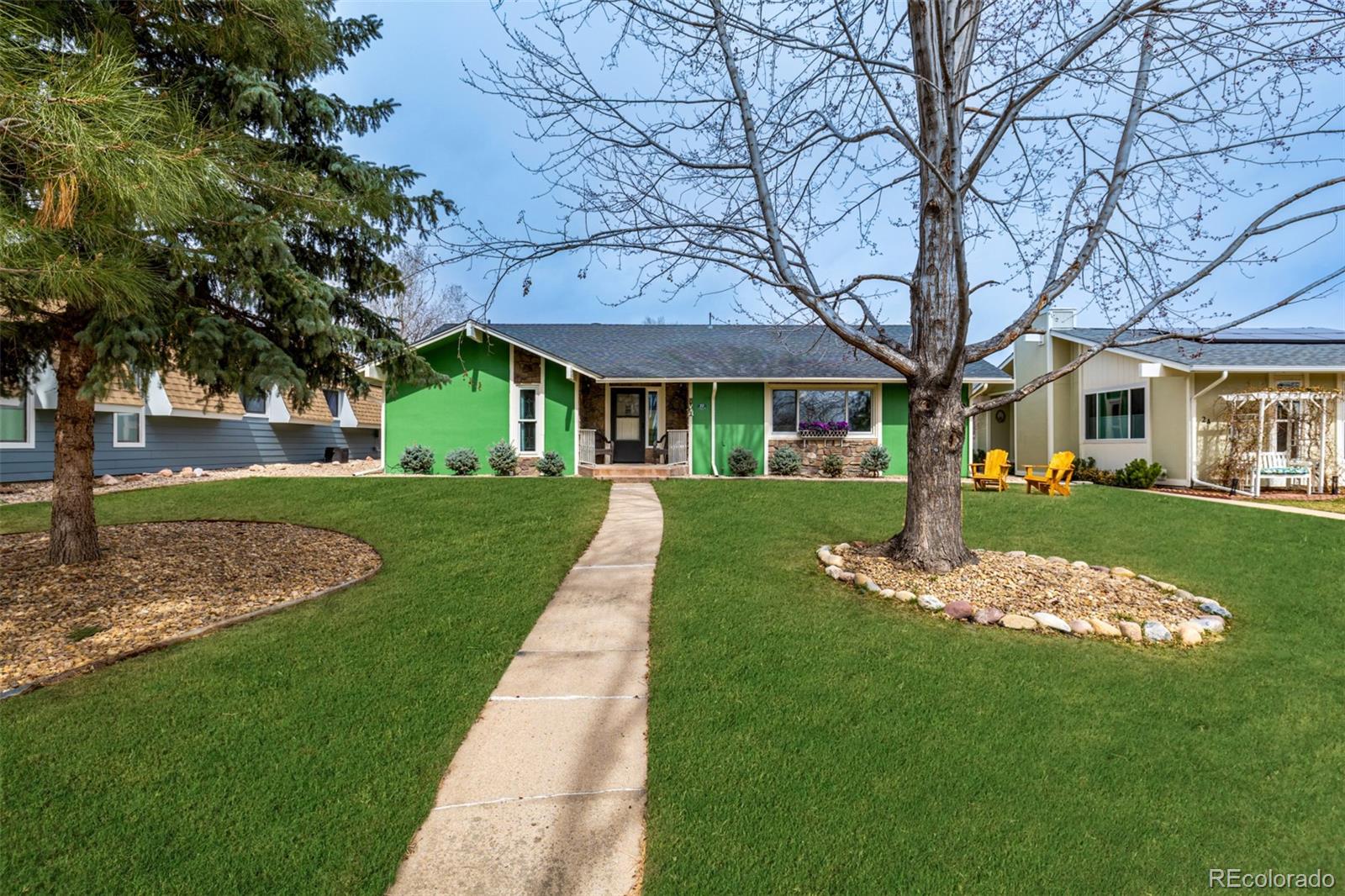 22 Scott Drive North Broomfield, CO 80020 - Photo 4 of 49 a front view of a house with a yard