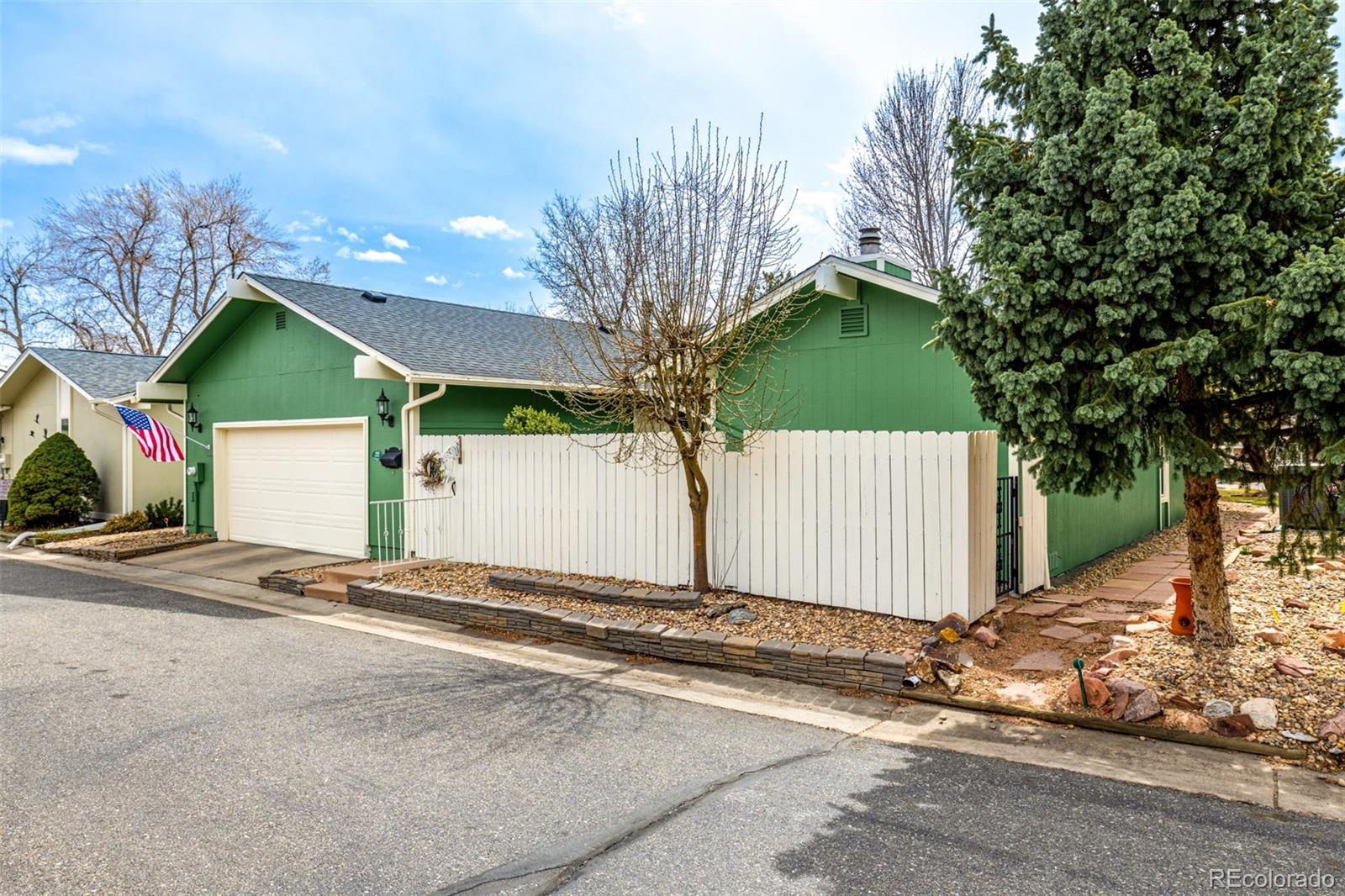 22 Scott Drive North Broomfield, CO 80020 - Photo 41 of 49 a view of a house with a yard and garage