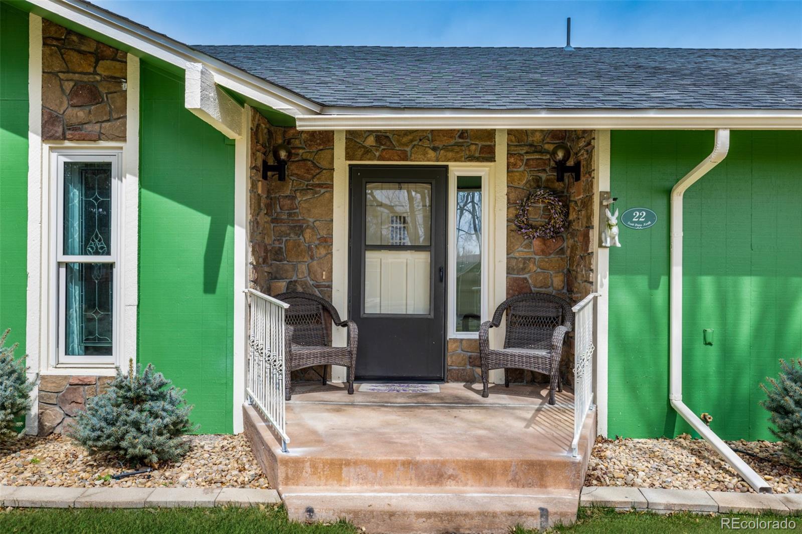 22 Scott Drive North Broomfield, CO 80020 - Photo 6 of 49 a front view of a house with a porch