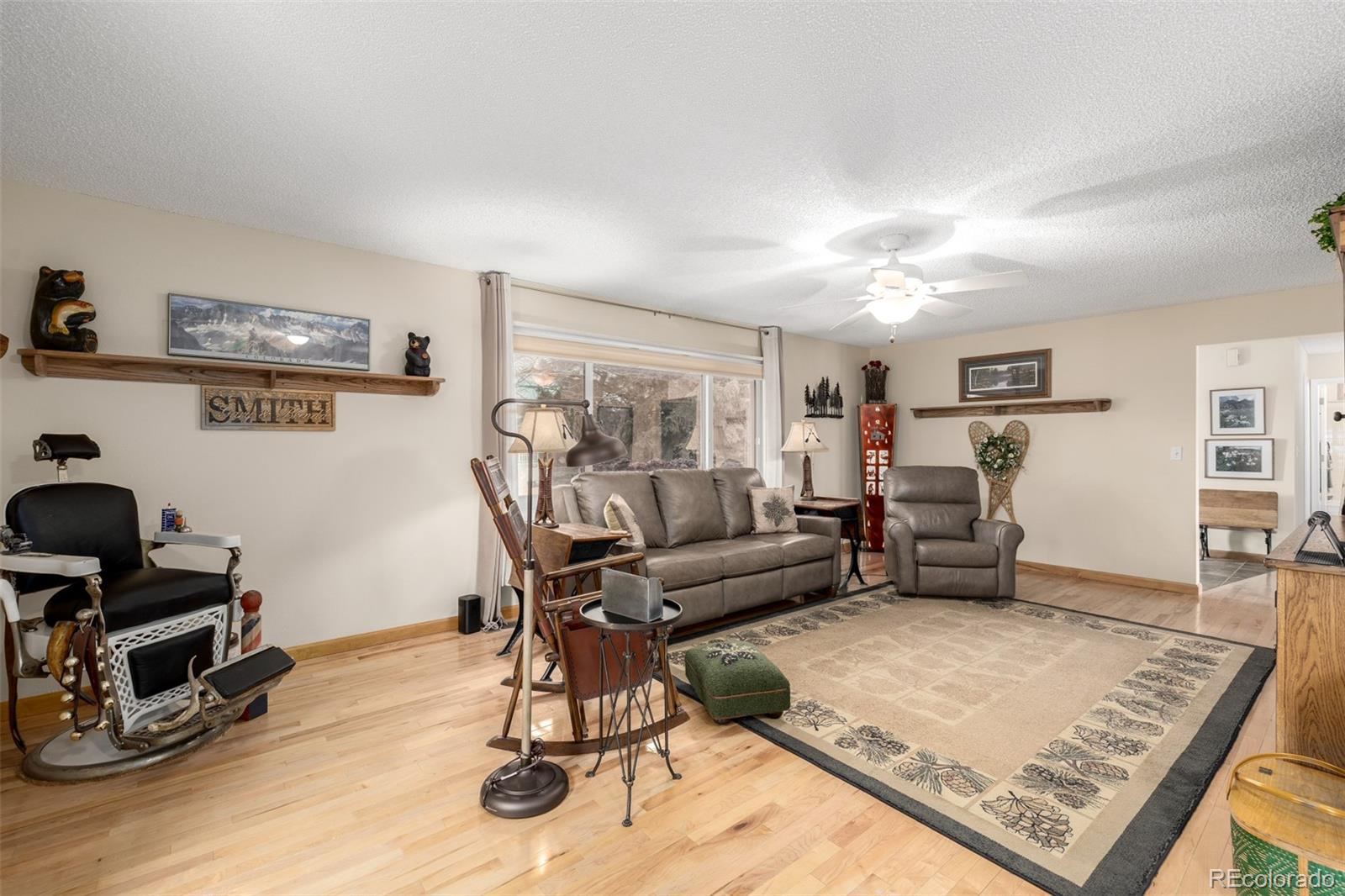22 Scott Drive North Broomfield, CO 80020 - Photo 10 of 49 a living room with furniture and wooden floor