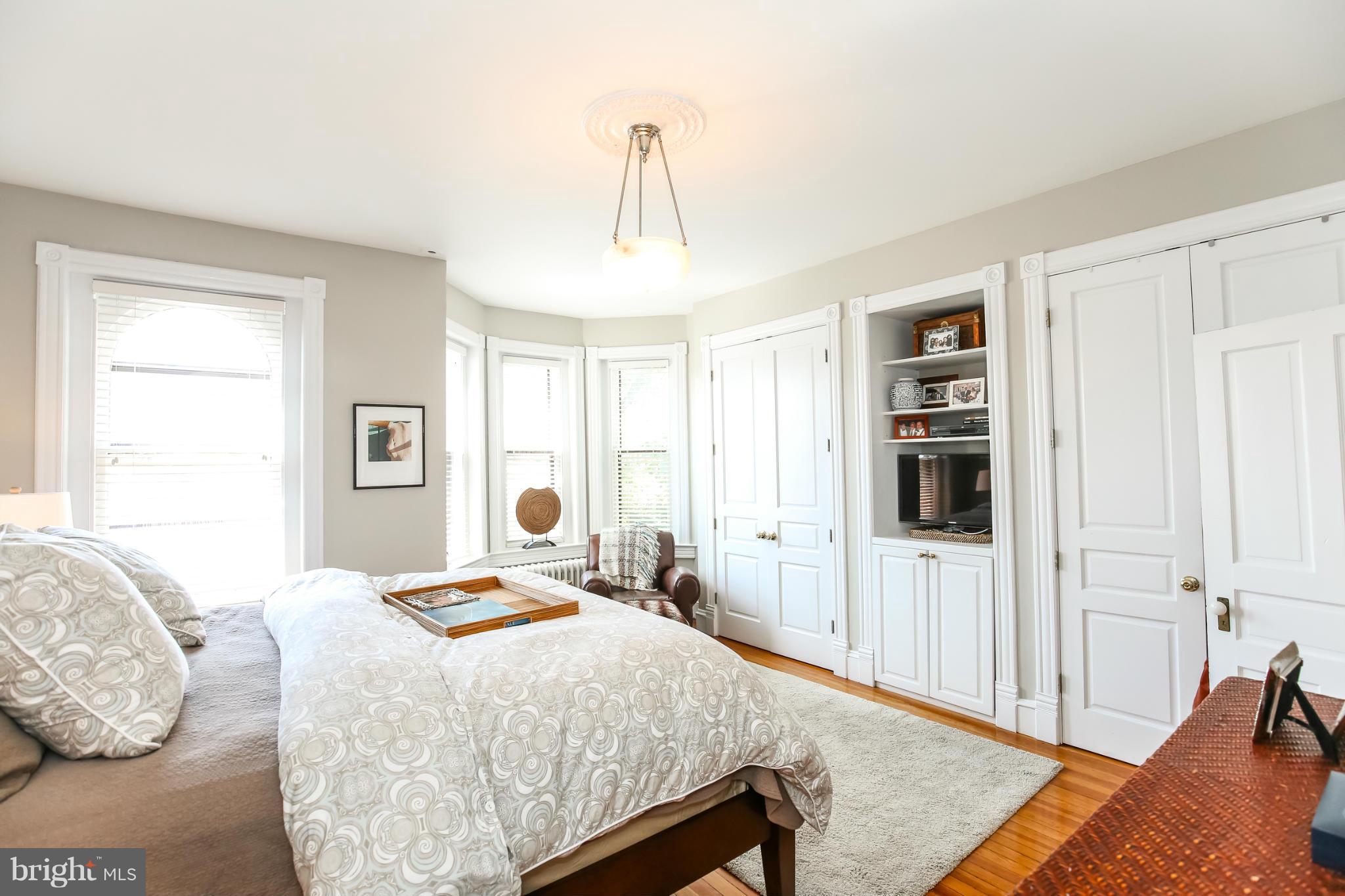 252 8th Street Southeast Washington, DC 20003 - Photo 19 of 29 a bedroom with a bed and a window