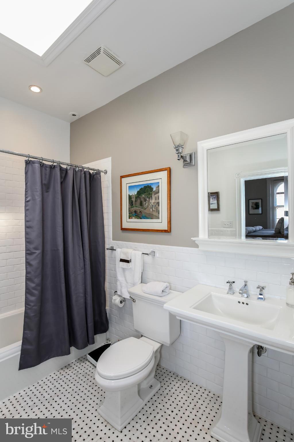 252 8th Street Southeast Washington, DC 20003 - Photo 21 of 29 a bathroom with a sink toilet and shower