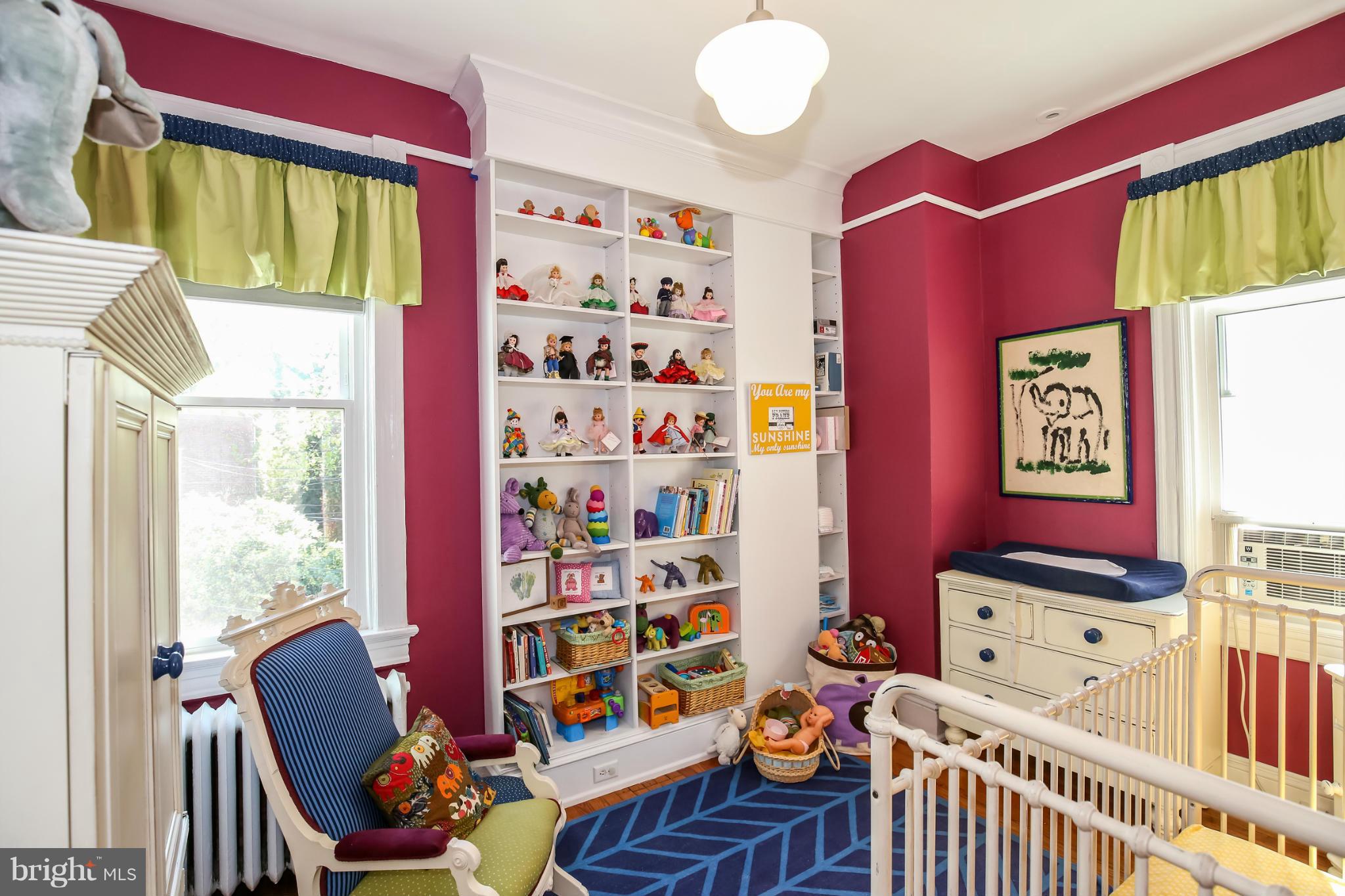 252 8th Street Southeast Washington, DC 20003 - Photo 24 of 29 a living room with furniture toys and a window