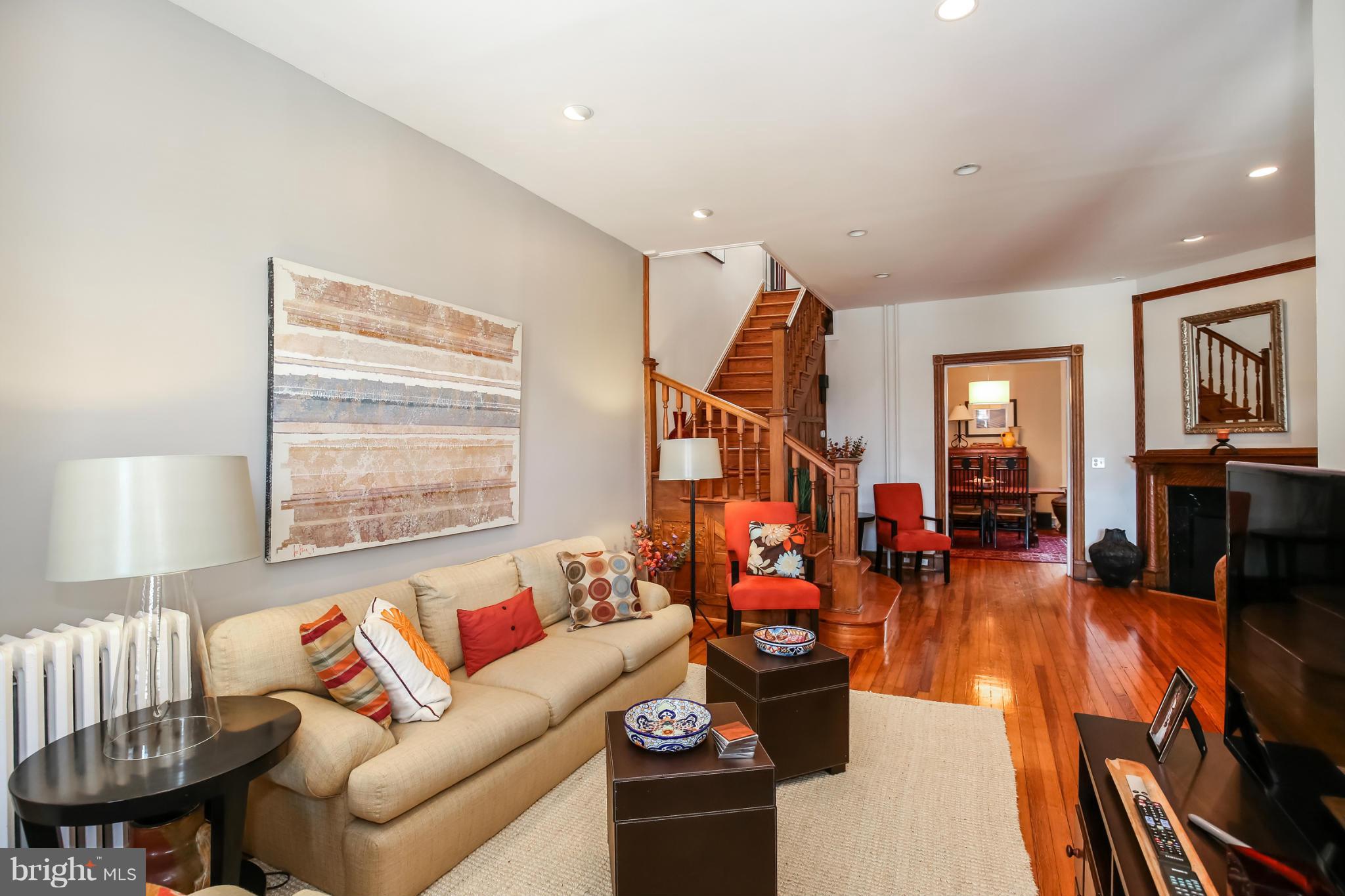 252 8th Street Southeast Washington, DC 20003 - Photo 6 of 29 a living room with furniture and a window