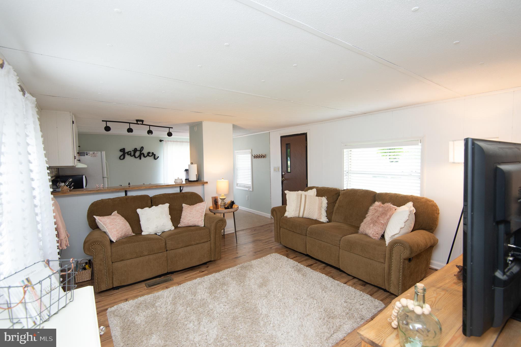5646 Eldorado-sharptown Road Rhodesdale, MD 21659 - Photo 3 of 12 a living room with furniture and a couch