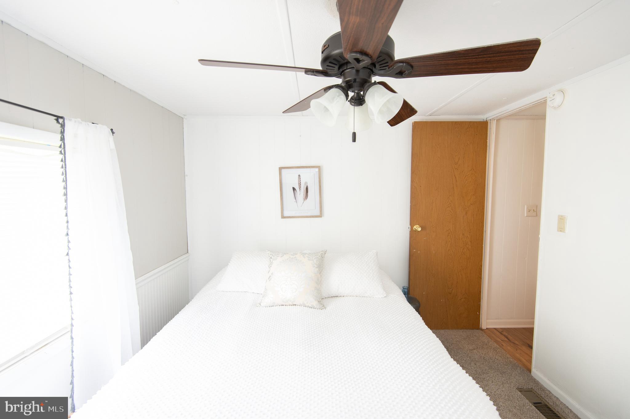 5646 Eldorado-sharptown Road Rhodesdale, MD 21659 - Photo 8 of 12 a view of a room with a ceiling fan
