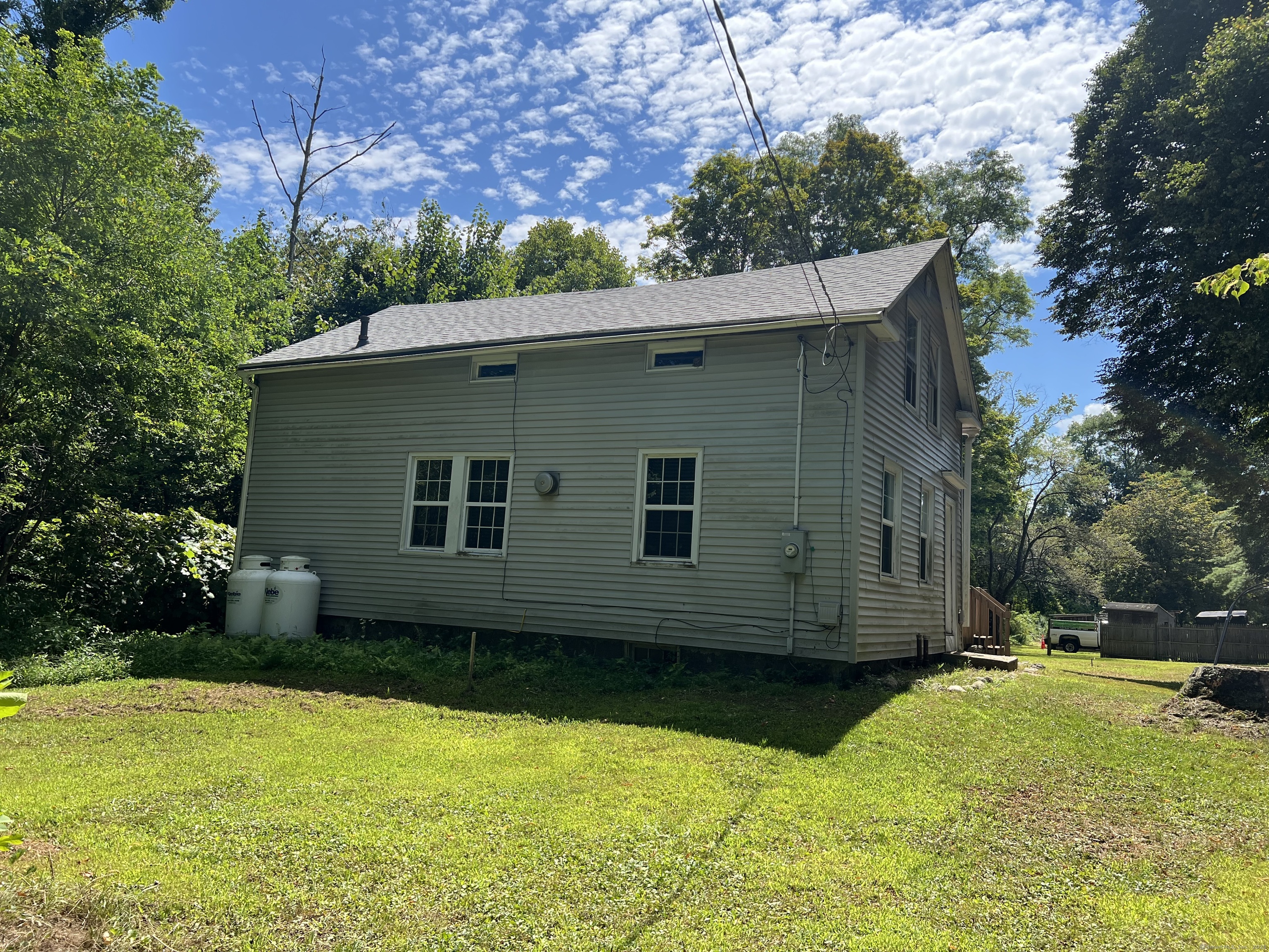 312 Colebrook River Road Colebrook, CT 06021 - Photo 3 of 7 a view of a backyard with plants and large tree