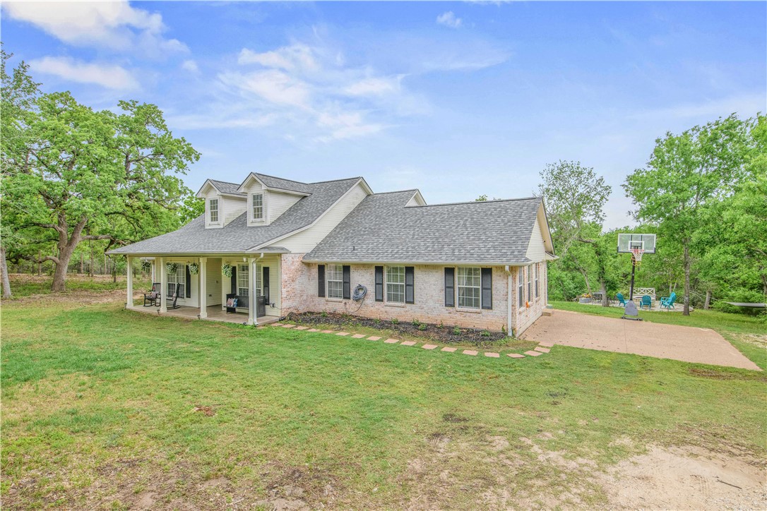 6538 Olympia Buddy Road College Station, TX 77845 - Photo 6 of 50 a view of a house with a big yard plants and large trees