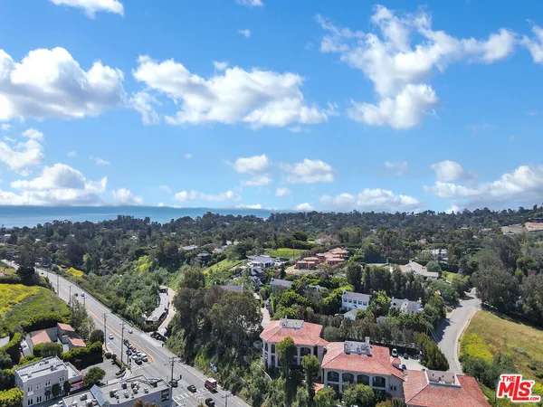a view of a city with green space