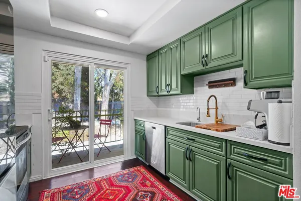 a kitchen with cabinets a window and a sink