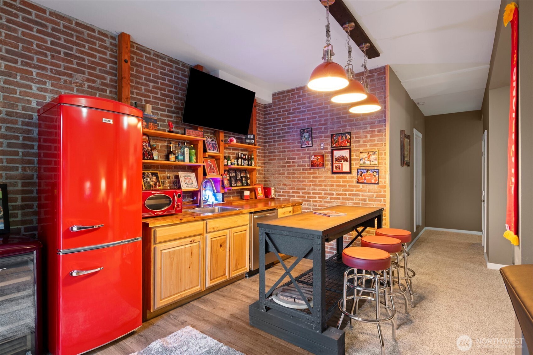12203 Rainbow Road Arlington, WA 98223 - Photo 24 of 40 a dining room filled with furniture and a flat screen tv