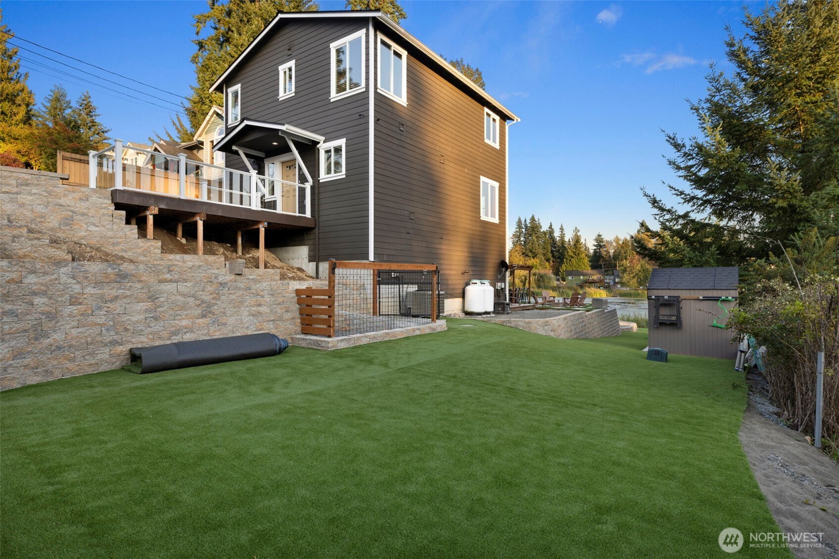 12203 Rainbow Road Arlington, WA 98223 - Photo 3 of 40 a front view of a house with a garden and plants