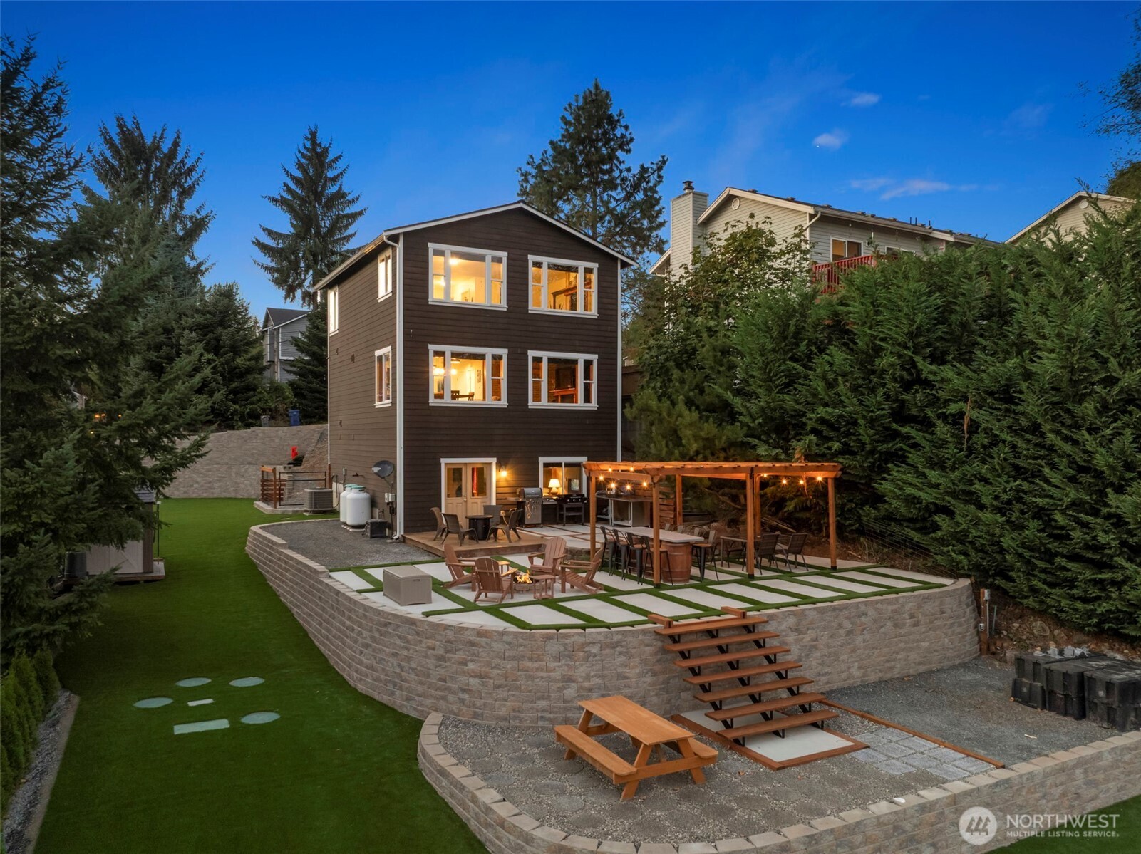 12203 Rainbow Road Arlington, WA 98223 - Photo 32 of 40 a view of a house with backyard water fountain and sitting area
