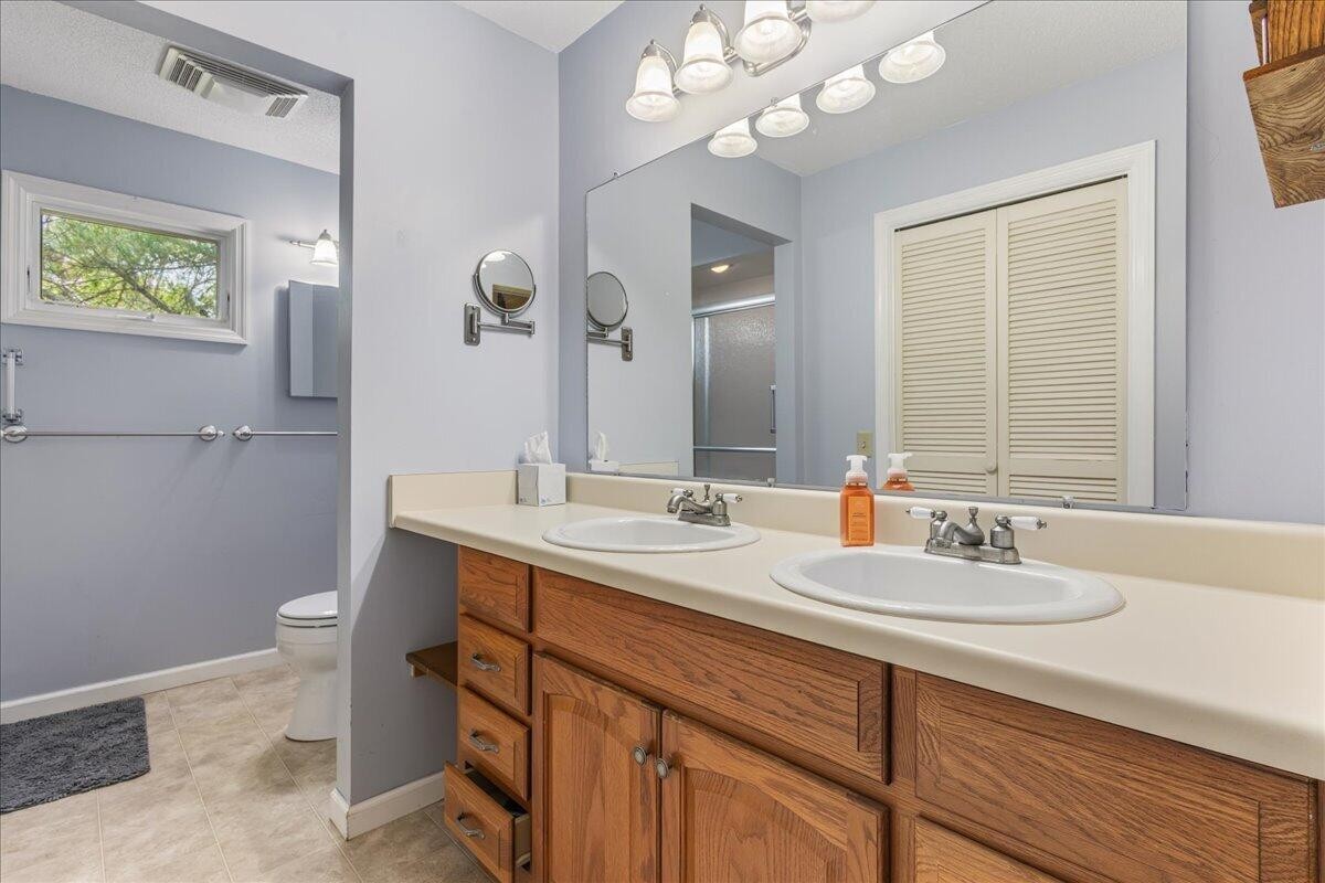 2522 Cindy Street Athens, TN 37303 - Photo 20 of 36 a bathroom with a sink a toilet and a mirror