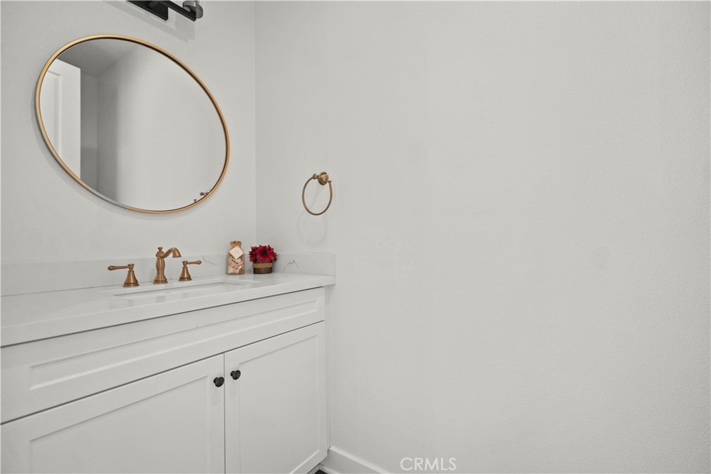 1672 3rd Street Duarte, CA 91010 - Photo 14 of 30 a bathroom with a sink and a mirror