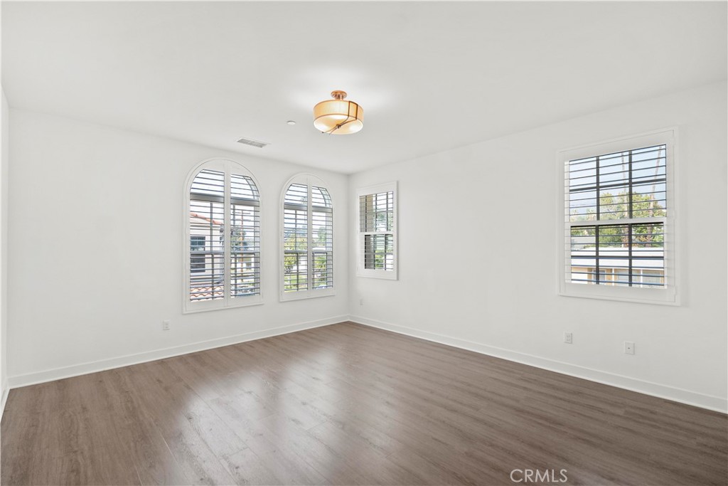 1672 3rd Street Duarte, CA 91010 - Photo 17 of 30 an empty room with wooden floor and windows