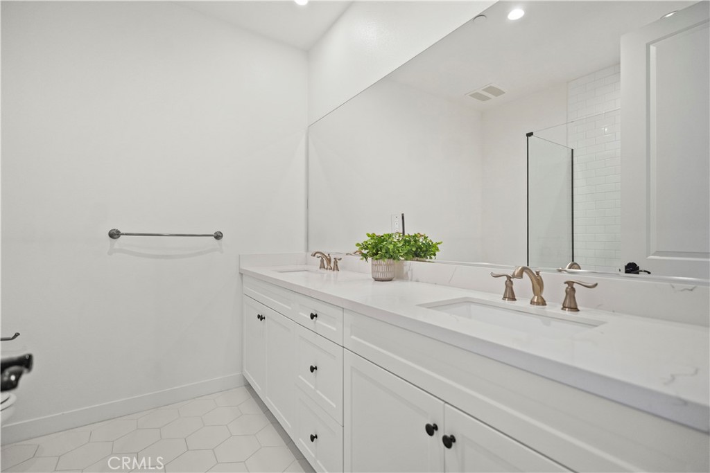 1672 3rd Street Duarte, CA 91010 - Photo 21 of 30 a bathroom with a sink and a mirror