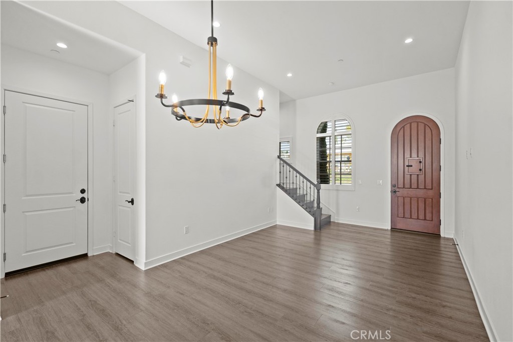 1672 3rd Street Duarte, CA 91010 - Photo 8 of 30 an empty room with wooden floor and windows