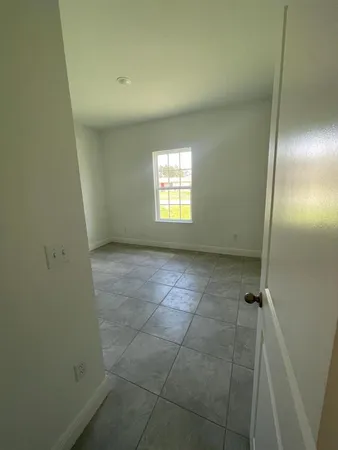 an empty room with a bathroom