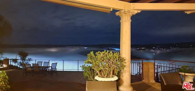 a view of balcony with chairs