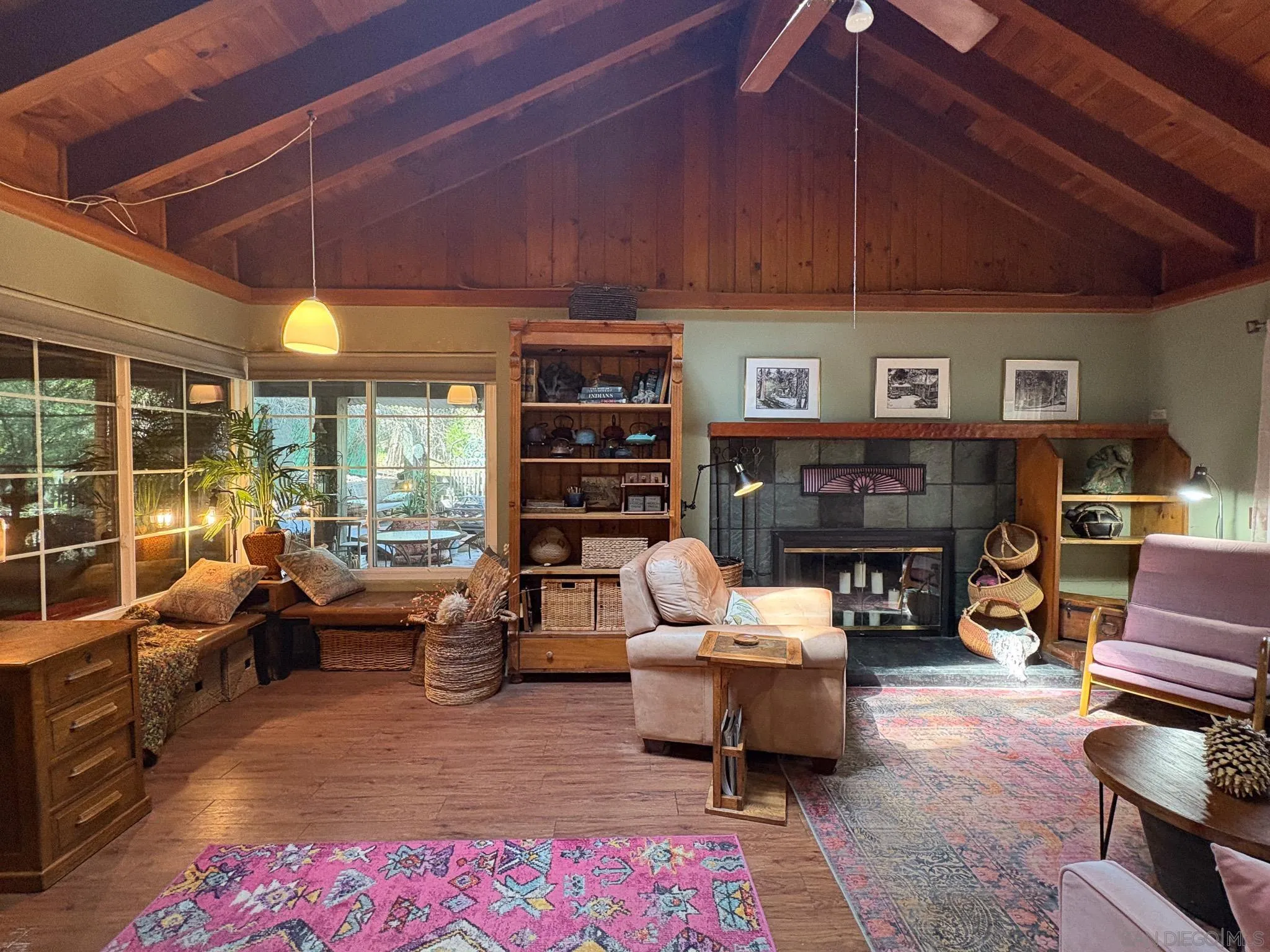 22188 Crestline Road Palomar Mountain, CA 92060 - Photo 14 of 69 a living room with furniture a fireplace and a table