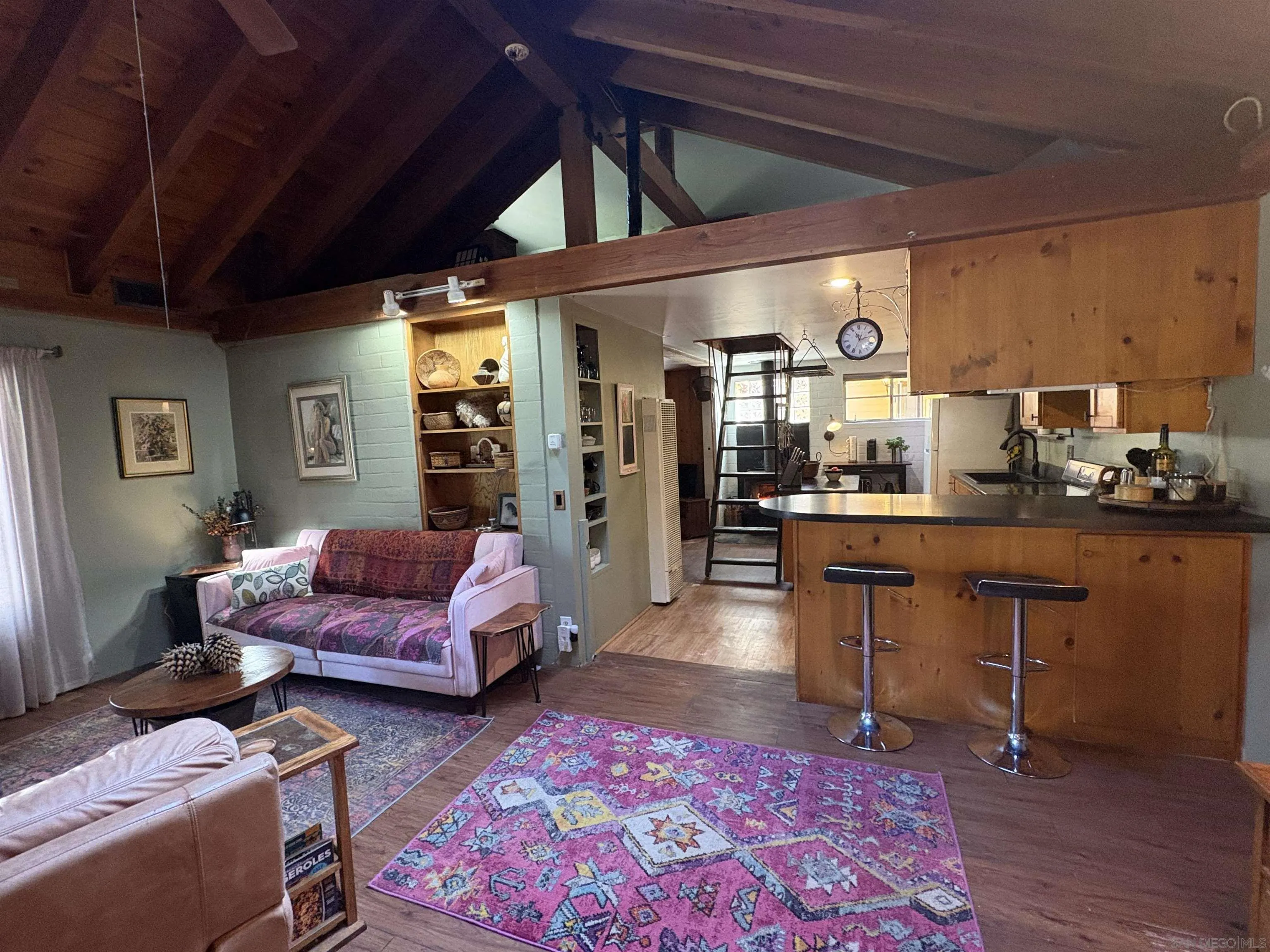 22188 Crestline Road Palomar Mountain, CA 92060 - Photo 21 of 69 a living room with furniture and wooden floor