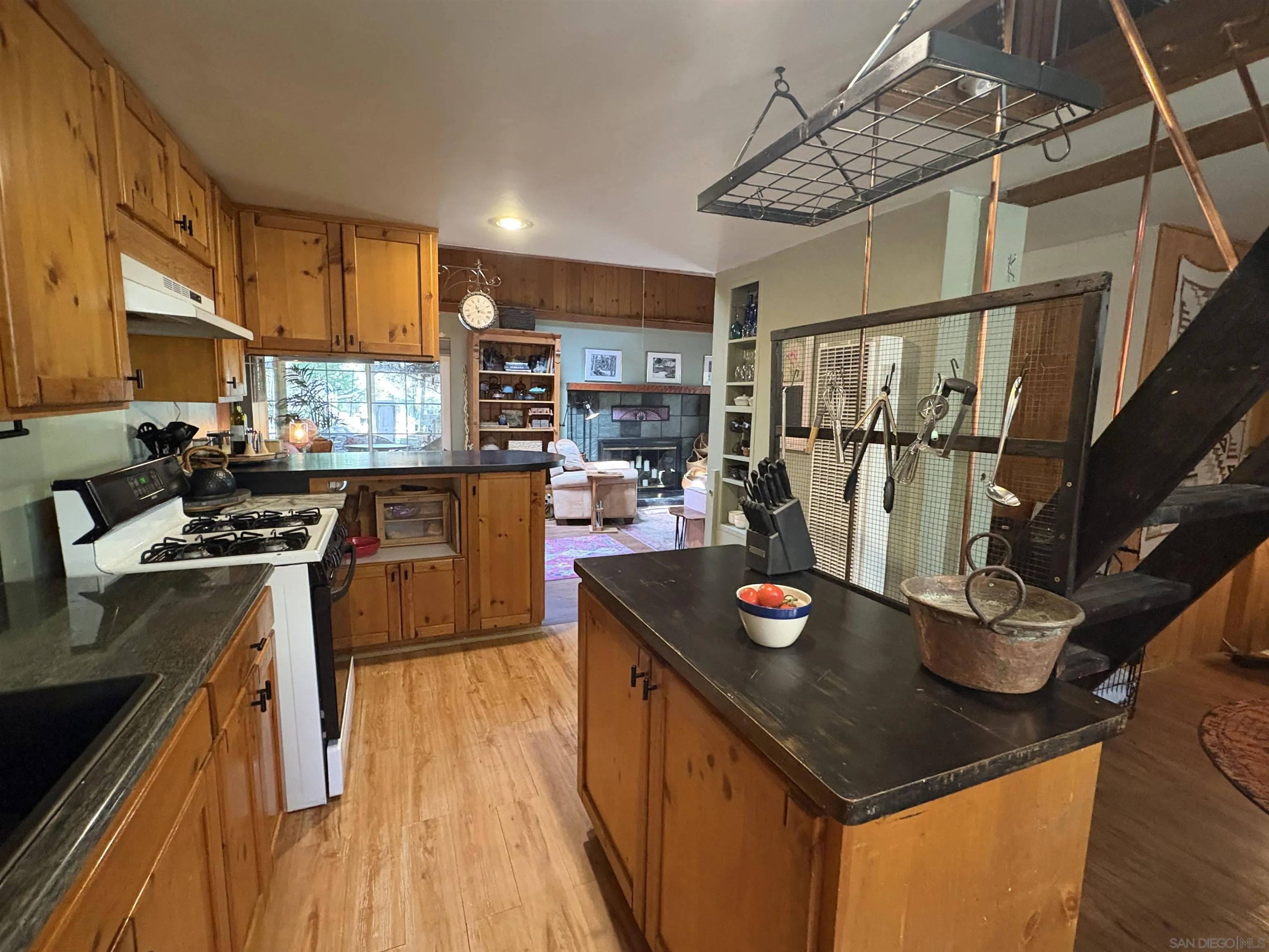 22188 Crestline Road Palomar Mountain, CA 92060 - Photo 29 of 69 a kitchen with stainless steel appliances granite countertop a sink stove and refrigerator