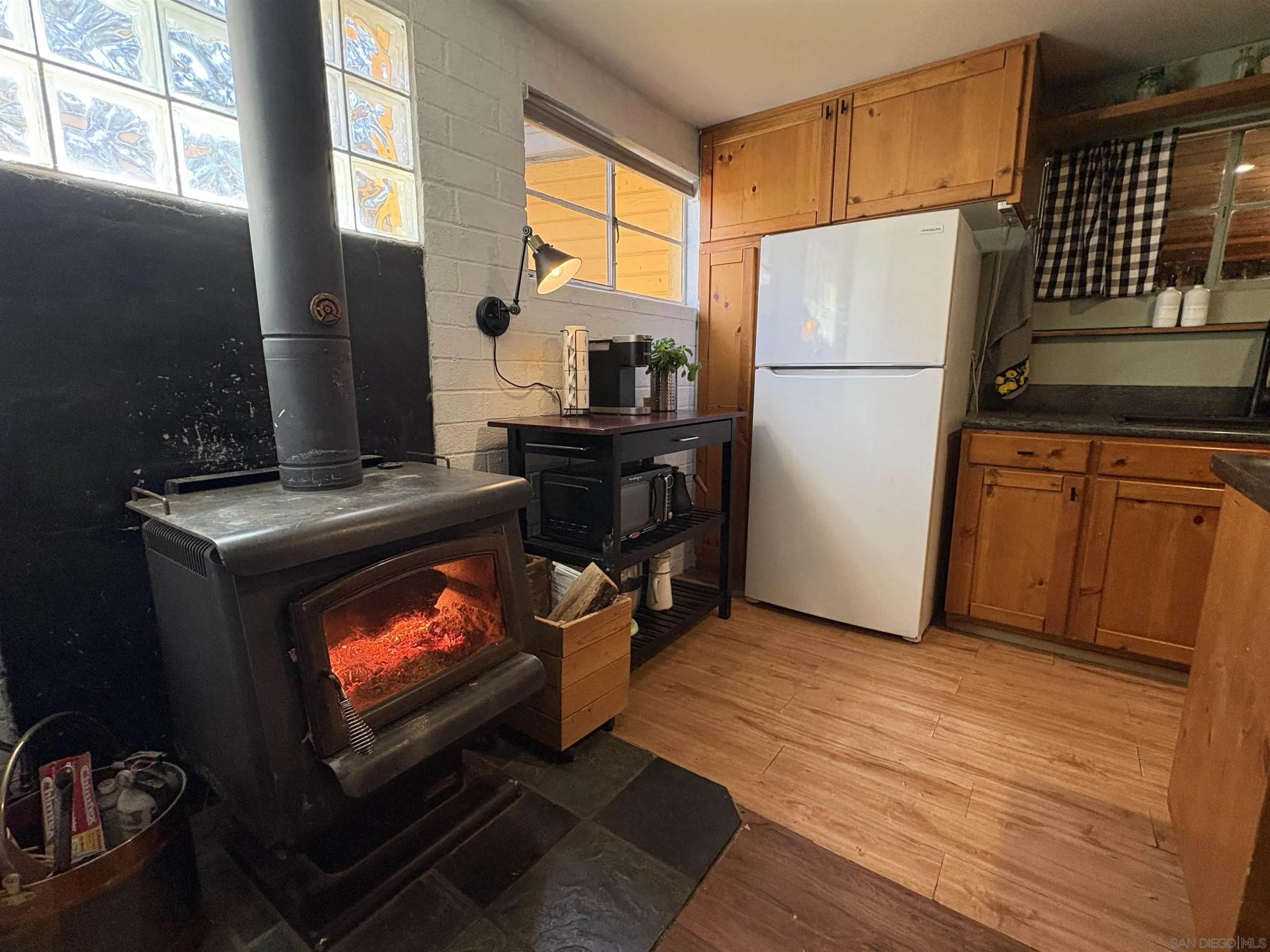 22188 Crestline Road Palomar Mountain, CA 92060 - Photo 30 of 69 a kitchen with stainless steel appliances a refrigerator stove and microwave