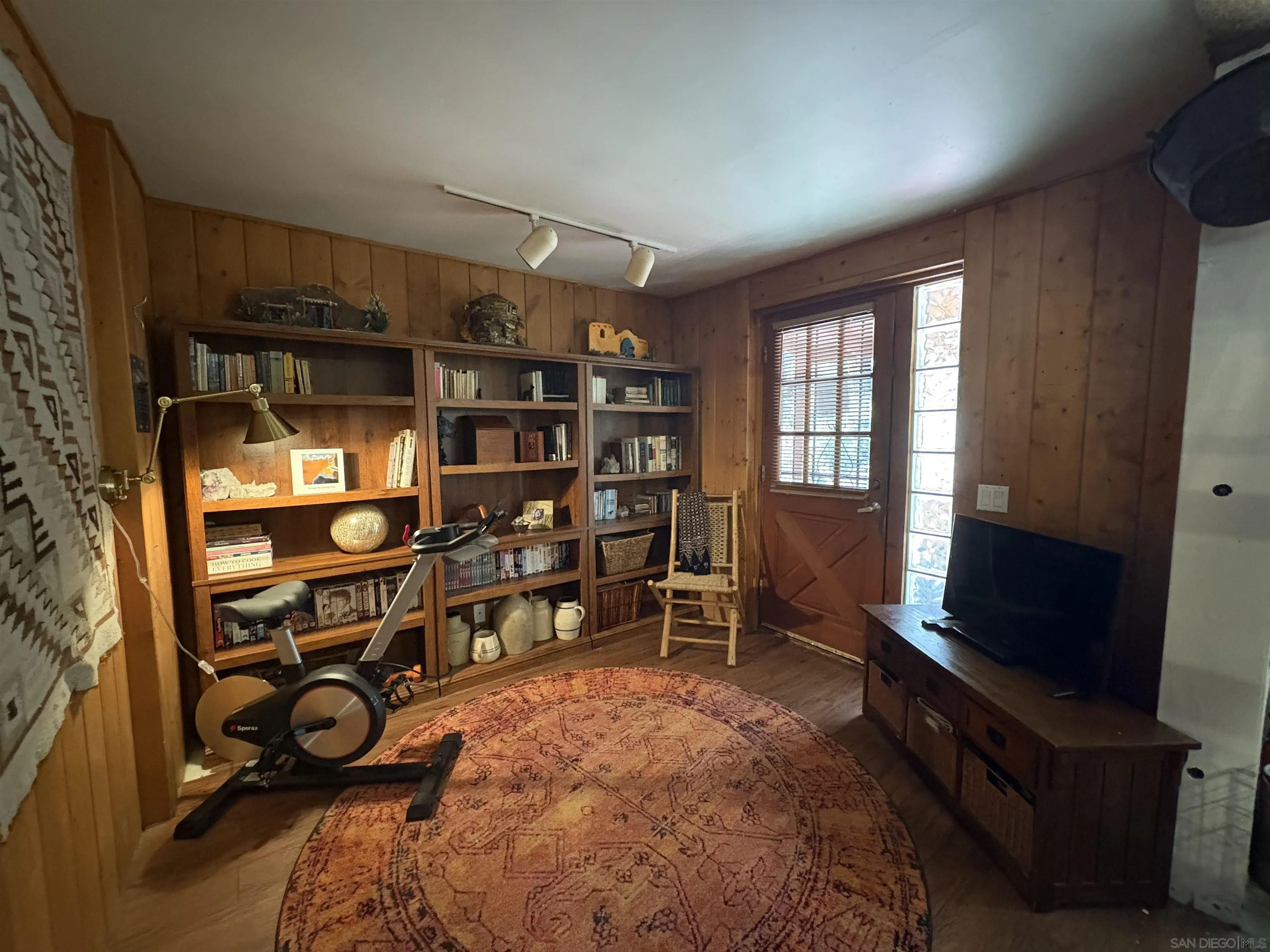 22188 Crestline Road Palomar Mountain, CA 92060 - Photo 34 of 69 a room with lots of books and a large window