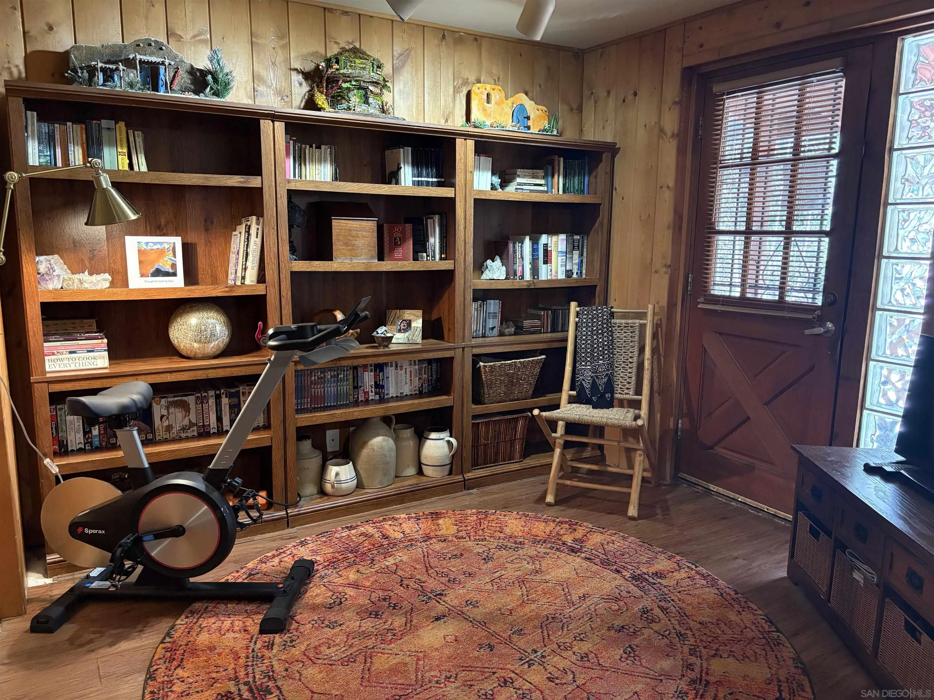 22188 Crestline Road Palomar Mountain, CA 92060 - Photo 36 of 69 a room with lots of books and a fireplace