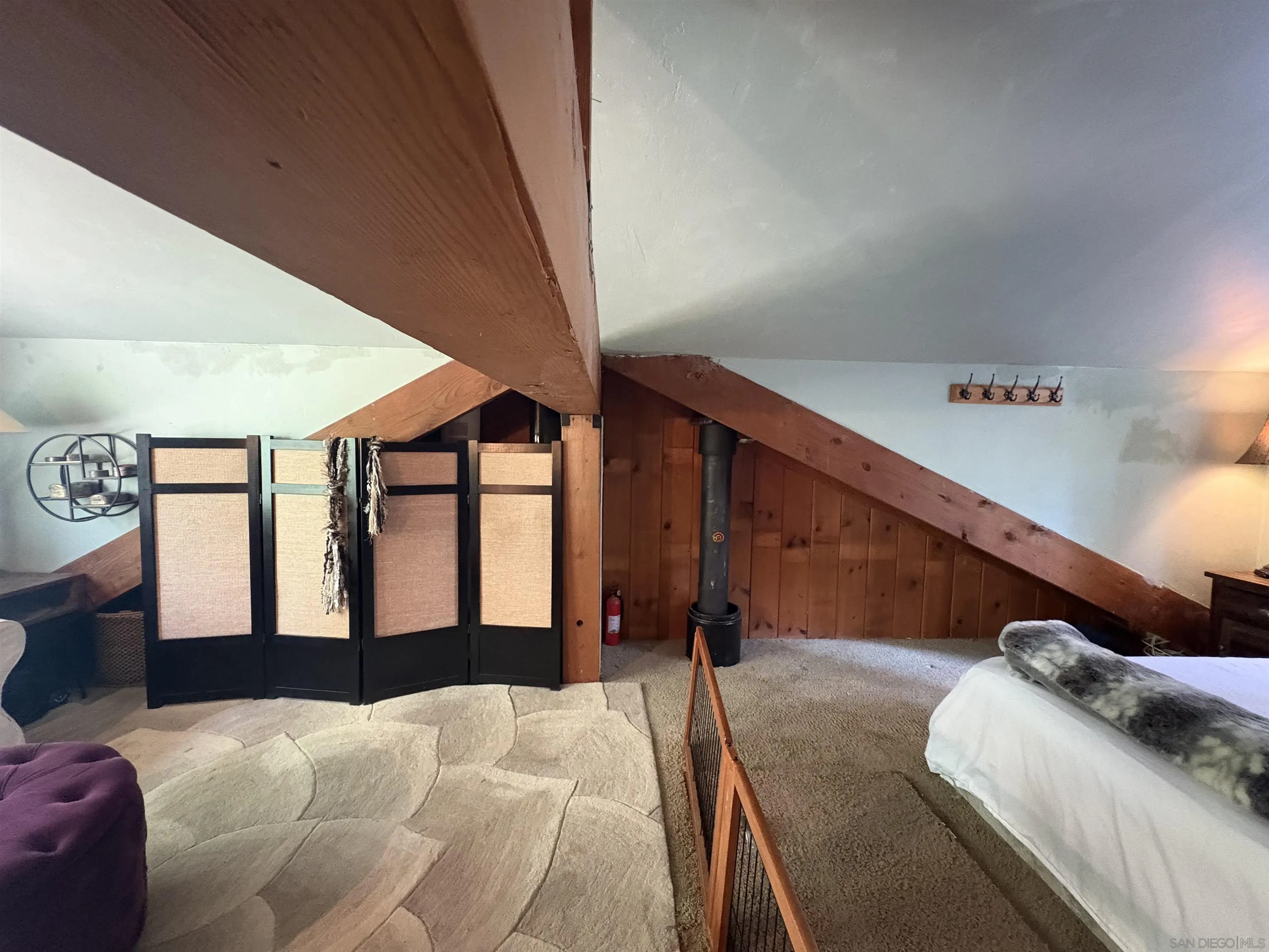 22188 Crestline Road Palomar Mountain, CA 92060 - Photo 46 of 69 a bed sitting in a bedroom next to a window