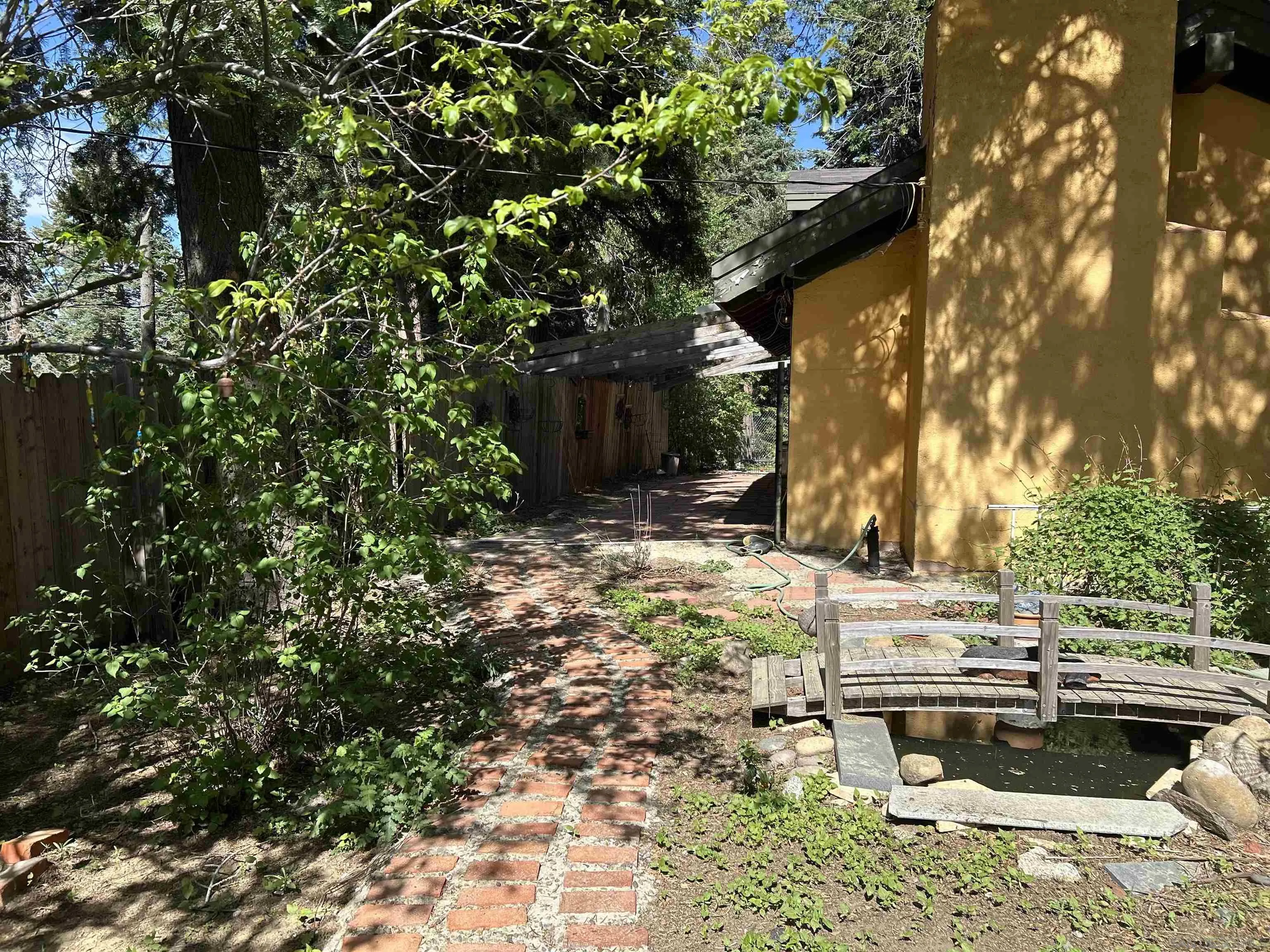22188 Crestline Road Palomar Mountain, CA 92060 - Photo 63 of 69 a backyard of a house with table and chairs
