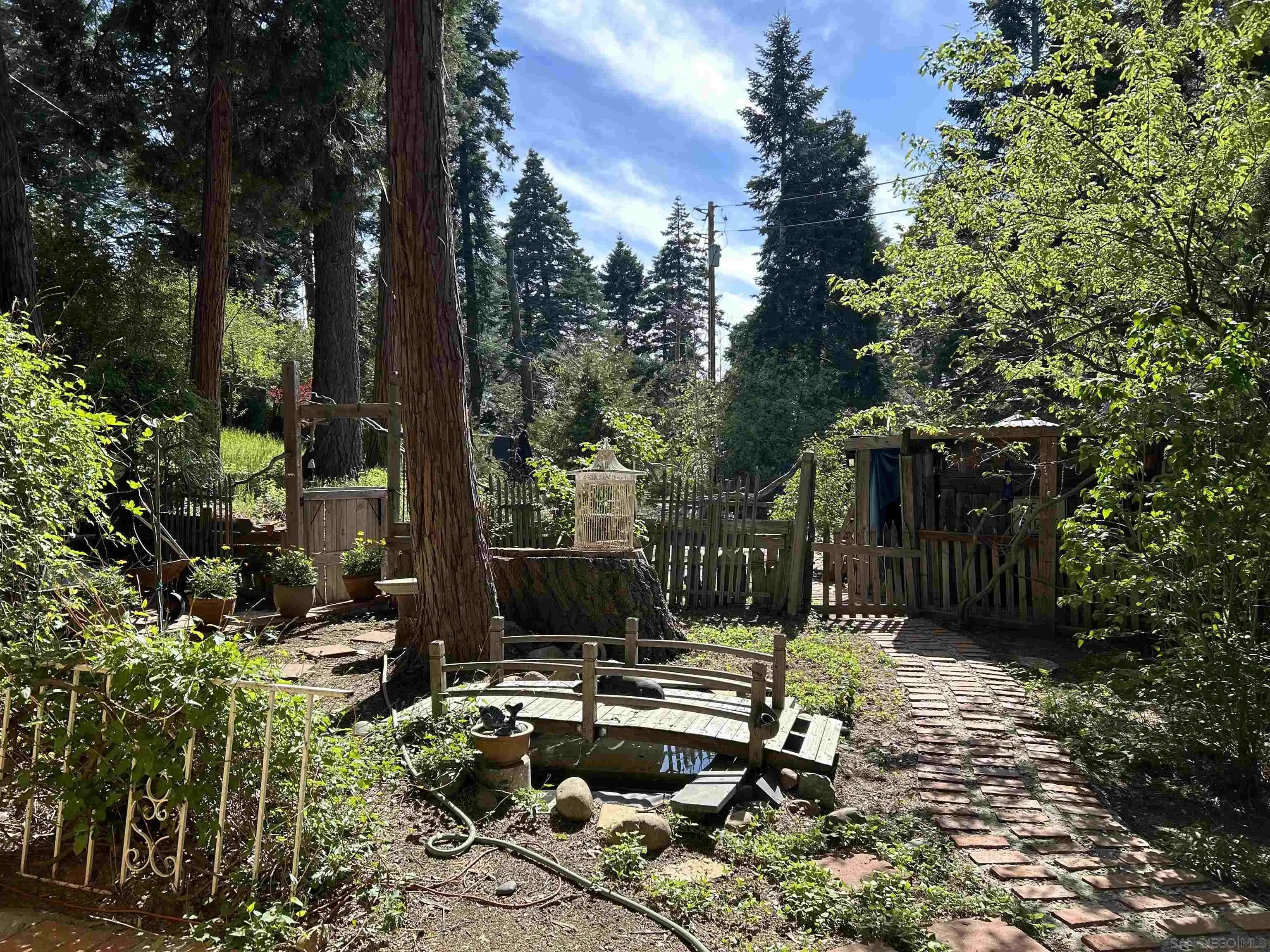 22188 Crestline Road Palomar Mountain, CA 92060 - Photo 65 of 69 a view of a bench in a backyard