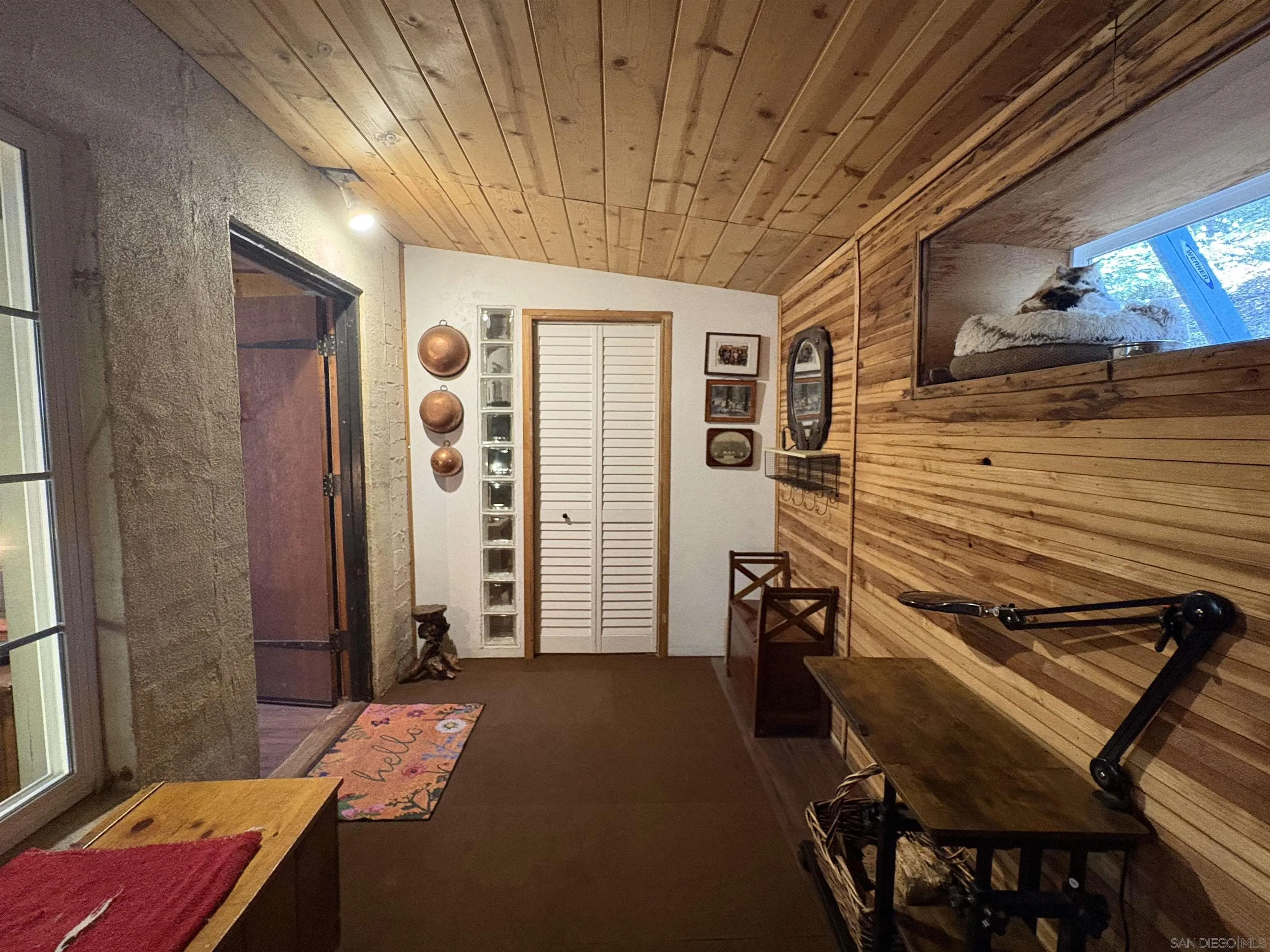 22188 Crestline Road Palomar Mountain, CA 92060 - Photo 8 of 69 a bedroom with a bed and wooden floor