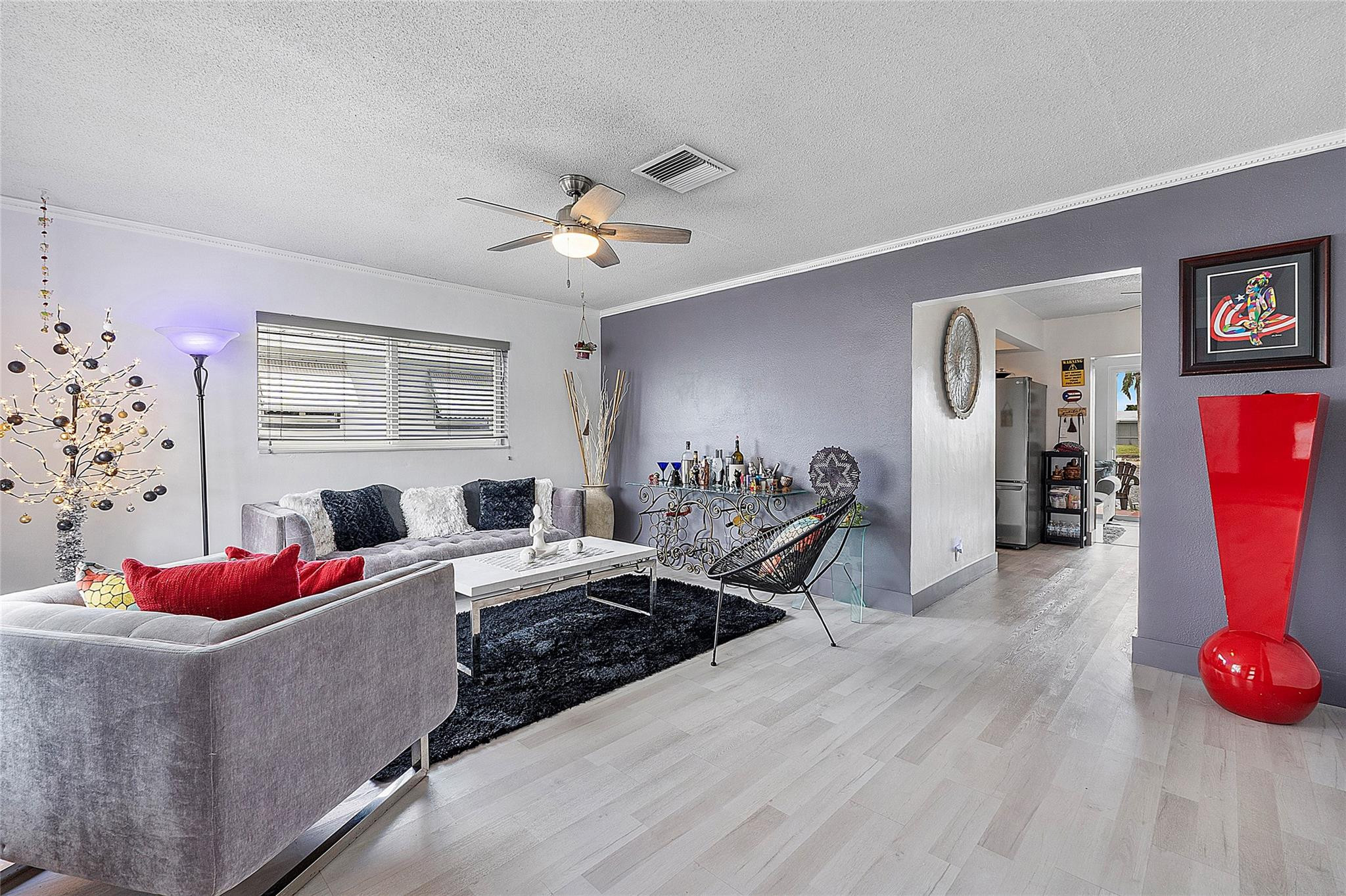 8103 Northwest 58th Place Tamarac, FL 33321 - Photo 11 of 19 a bedroom with furniture and a window