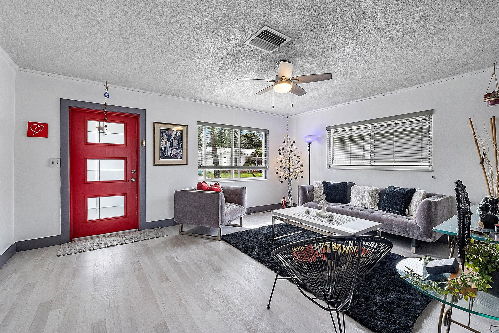 8103 Northwest 58th Place Tamarac, FL 33321 - Photo 12 of 19 a living room with furniture and a wooden floor