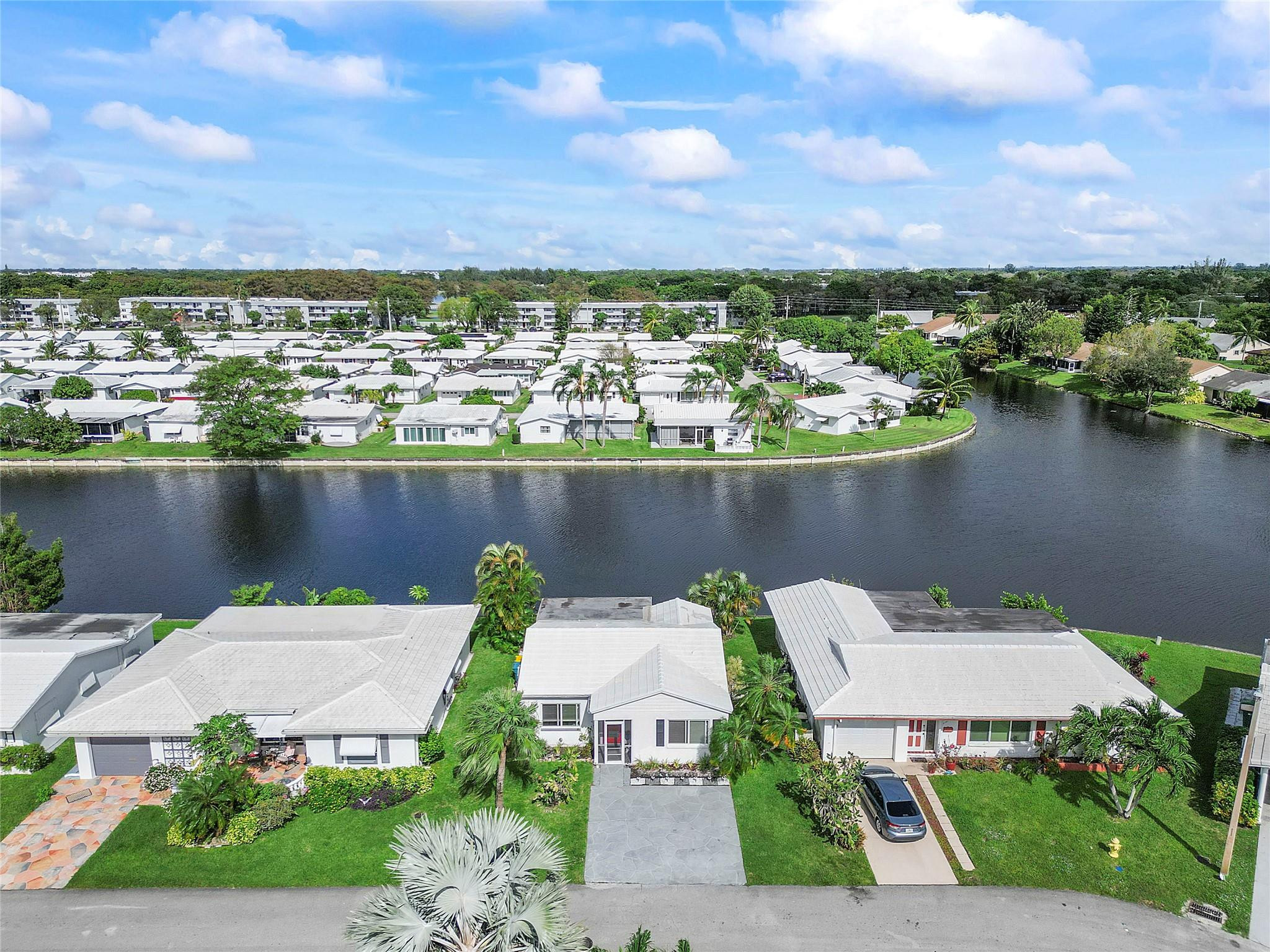 8103 Northwest 58th Place Tamarac, FL 33321 - Photo 17 of 19 an aerial view of a house with a lake view