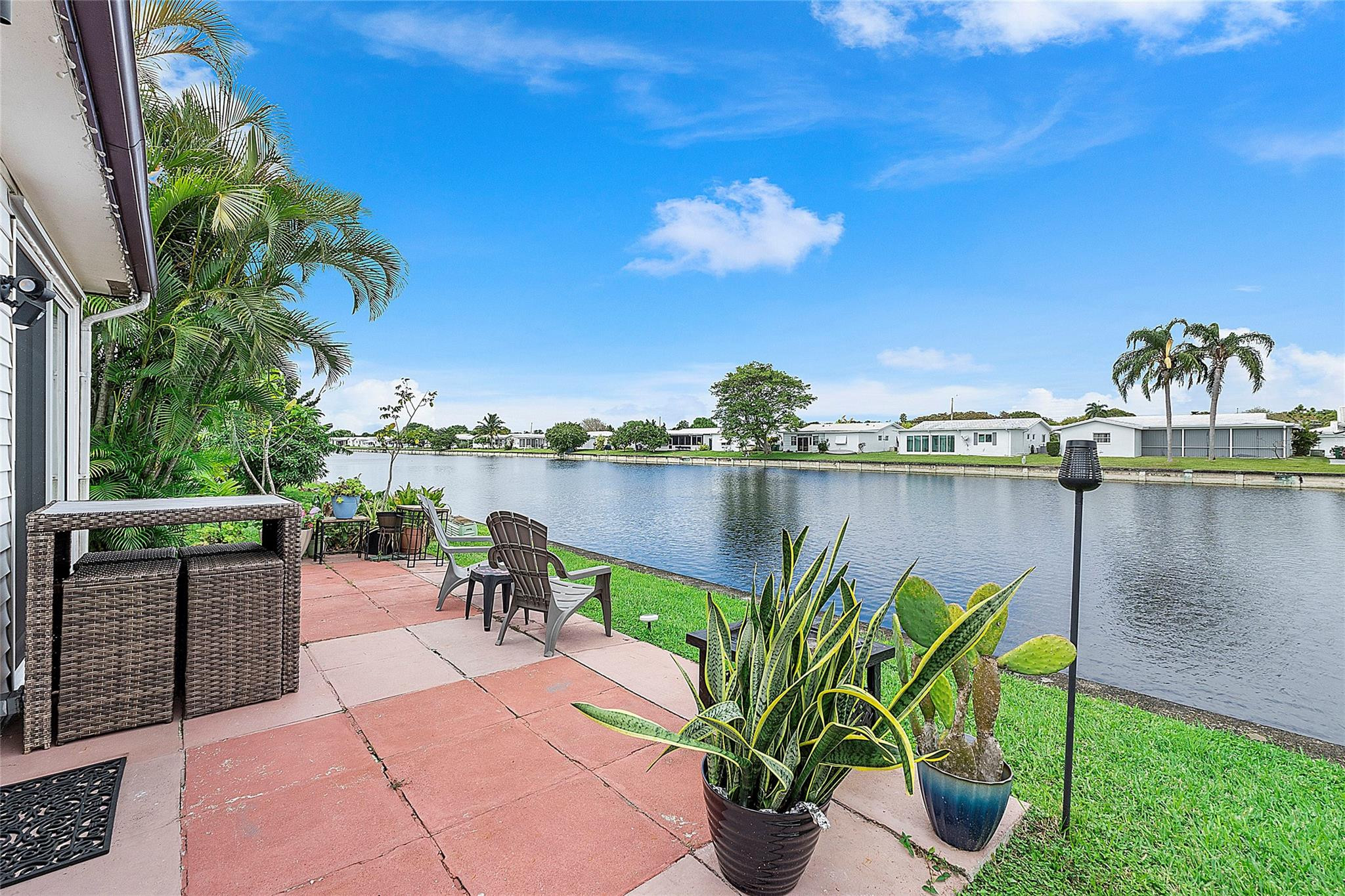 8103 Northwest 58th Place Tamarac, FL 33321 - Photo 5 of 19 a view of a lake with couches and wooden floor