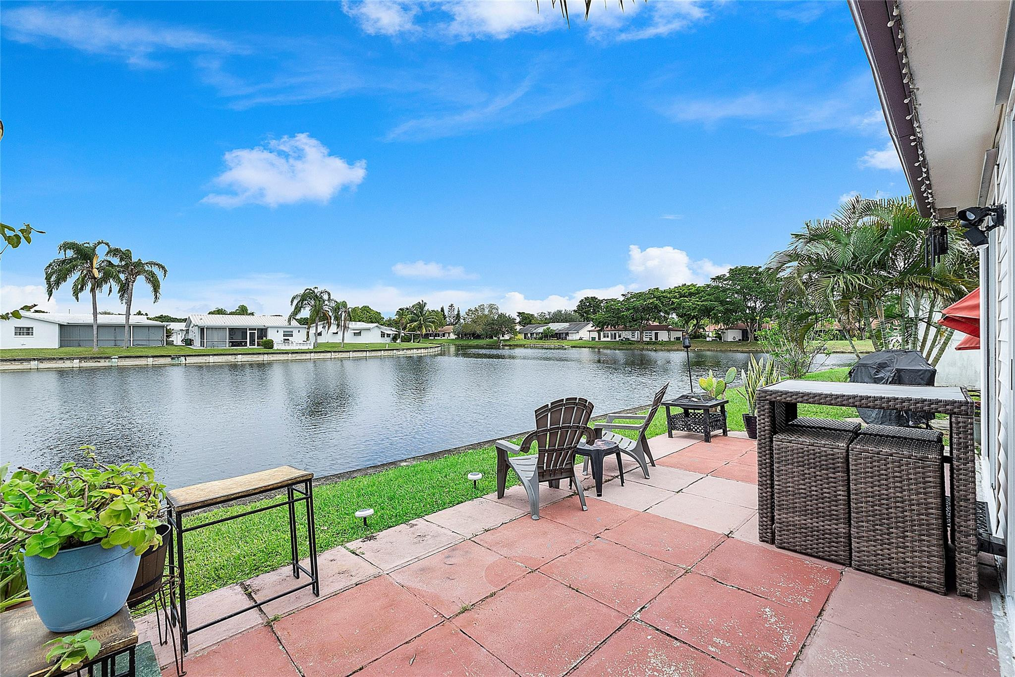 8103 Northwest 58th Place Tamarac, FL 33321 - Photo 6 of 19 a view of a lake with a patio