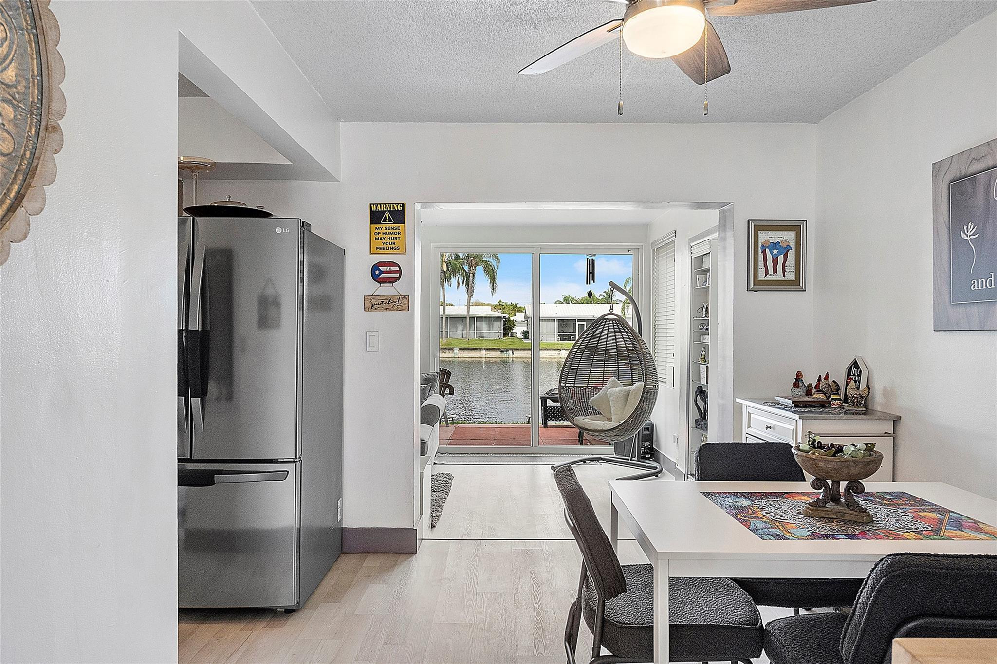 8103 Northwest 58th Place Tamarac, FL 33321 - Photo 8 of 19 a kitchen with stainless steel appliances granite countertop a refrigerator a sink a stove and island